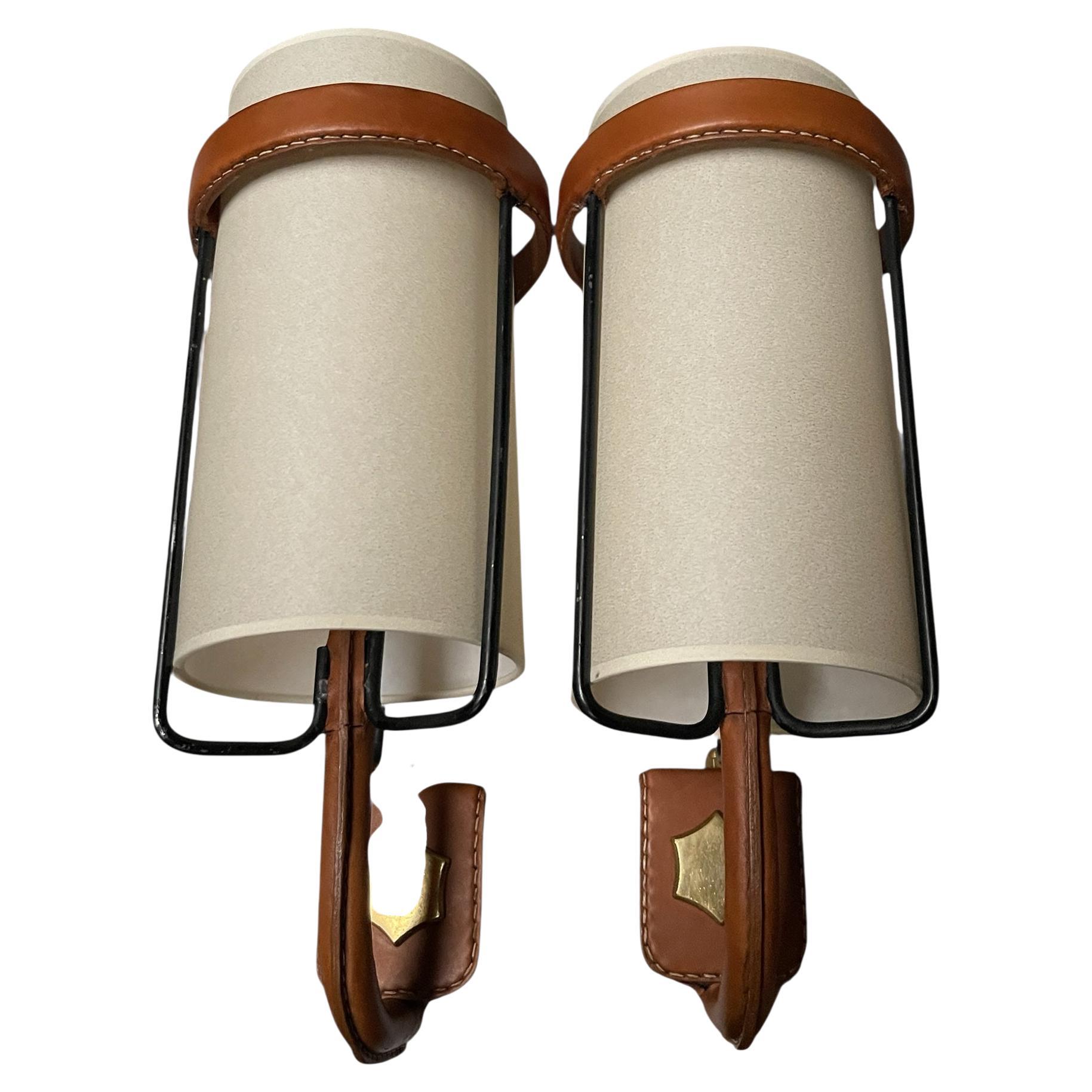 1950
s Stitched leather sconces by Jacques Adnet