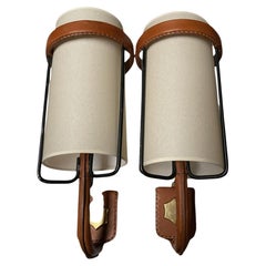 1950
s Stitched leather sconces by Jacques Adnet