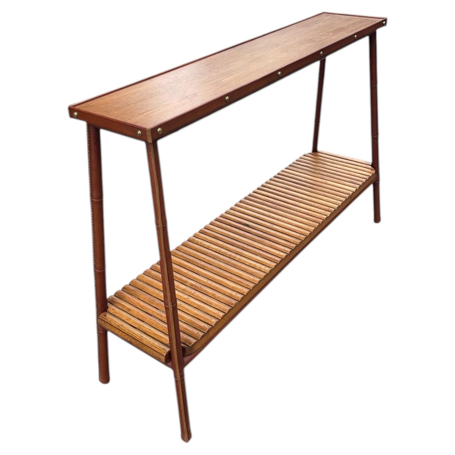 1950's Stitched leather shelve by Jacques Adnet