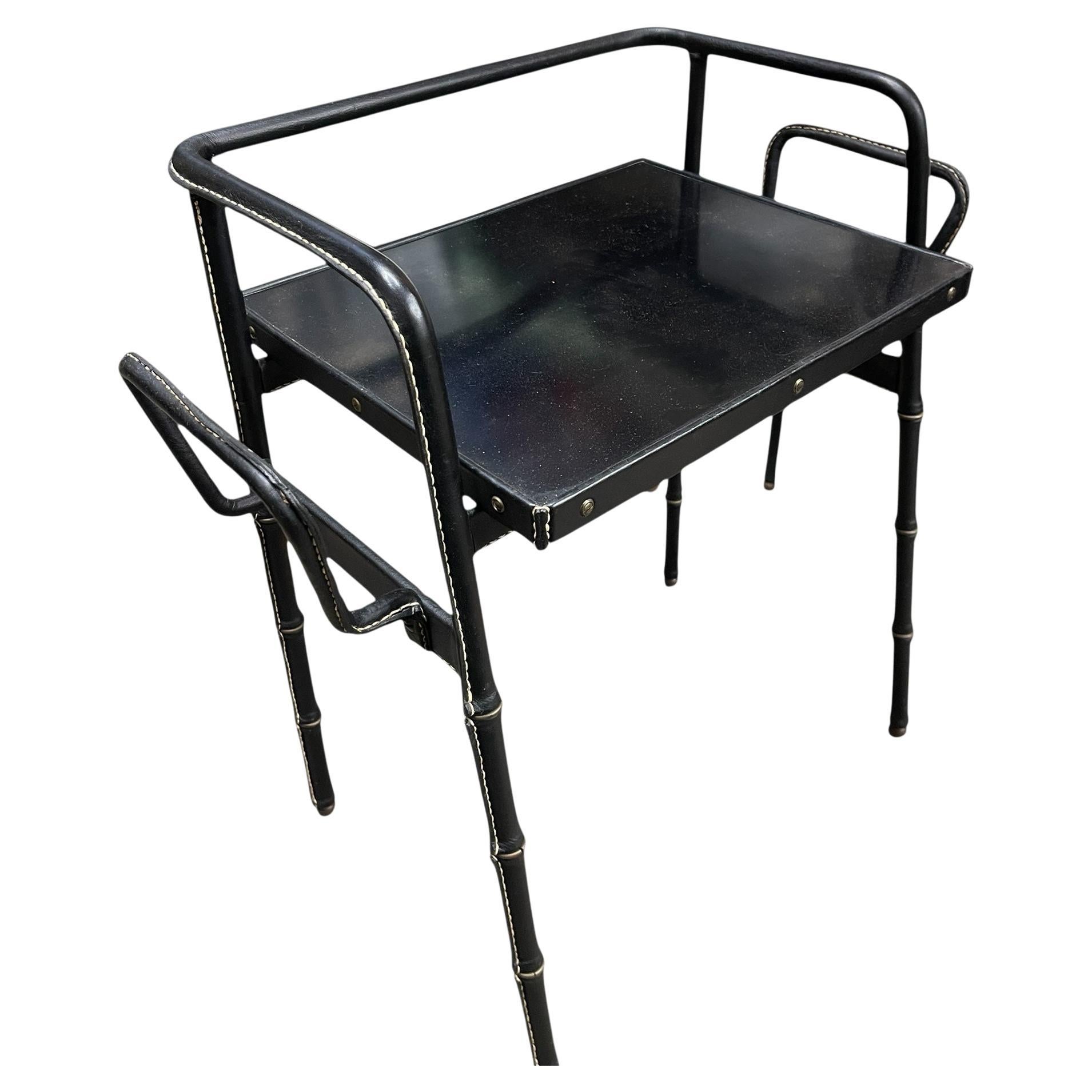 1950's Stitched leather side. table by Jacques Adnet