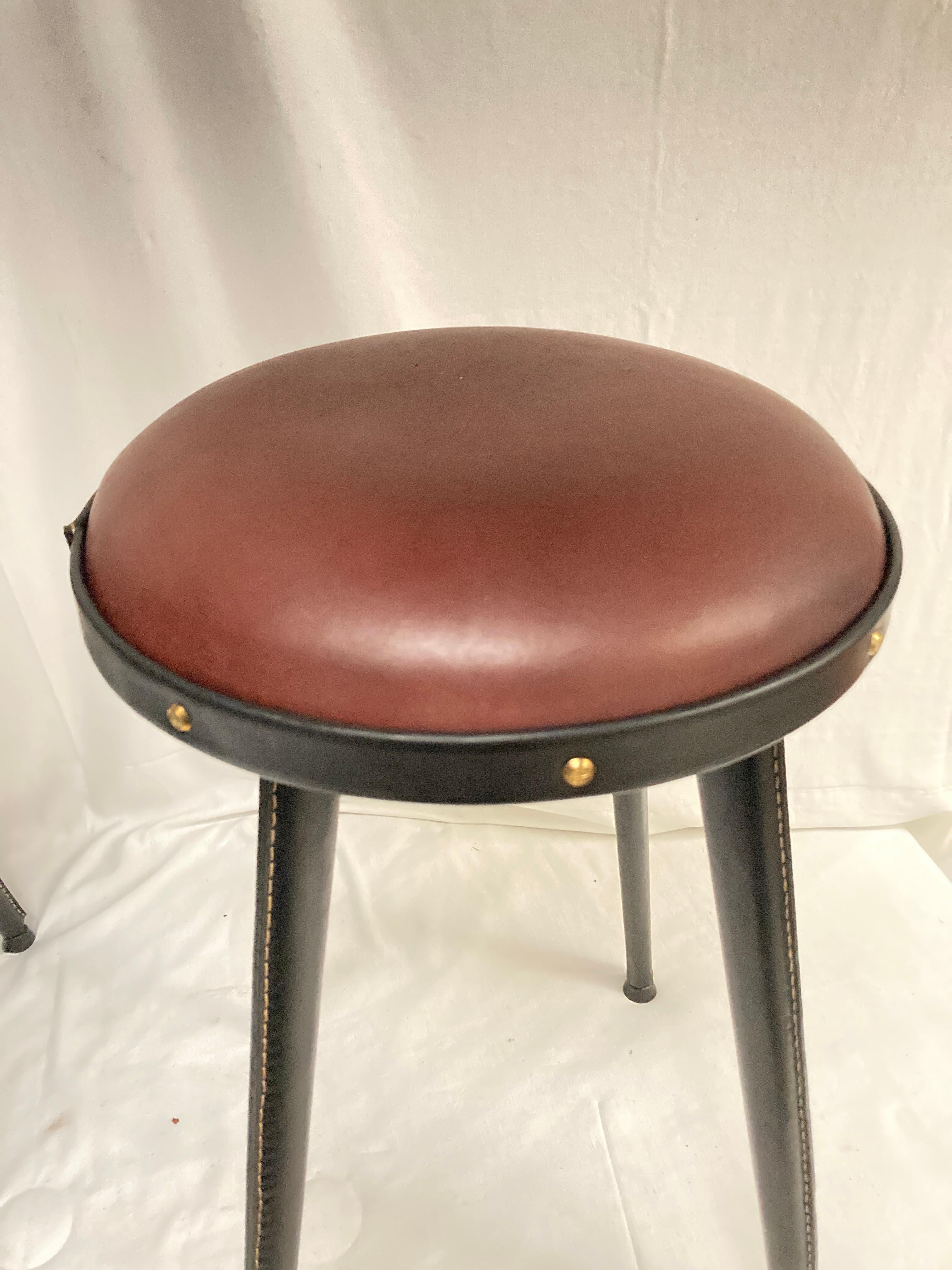 French 1950's Stitched leather stools by Jacques Adnet For Sale