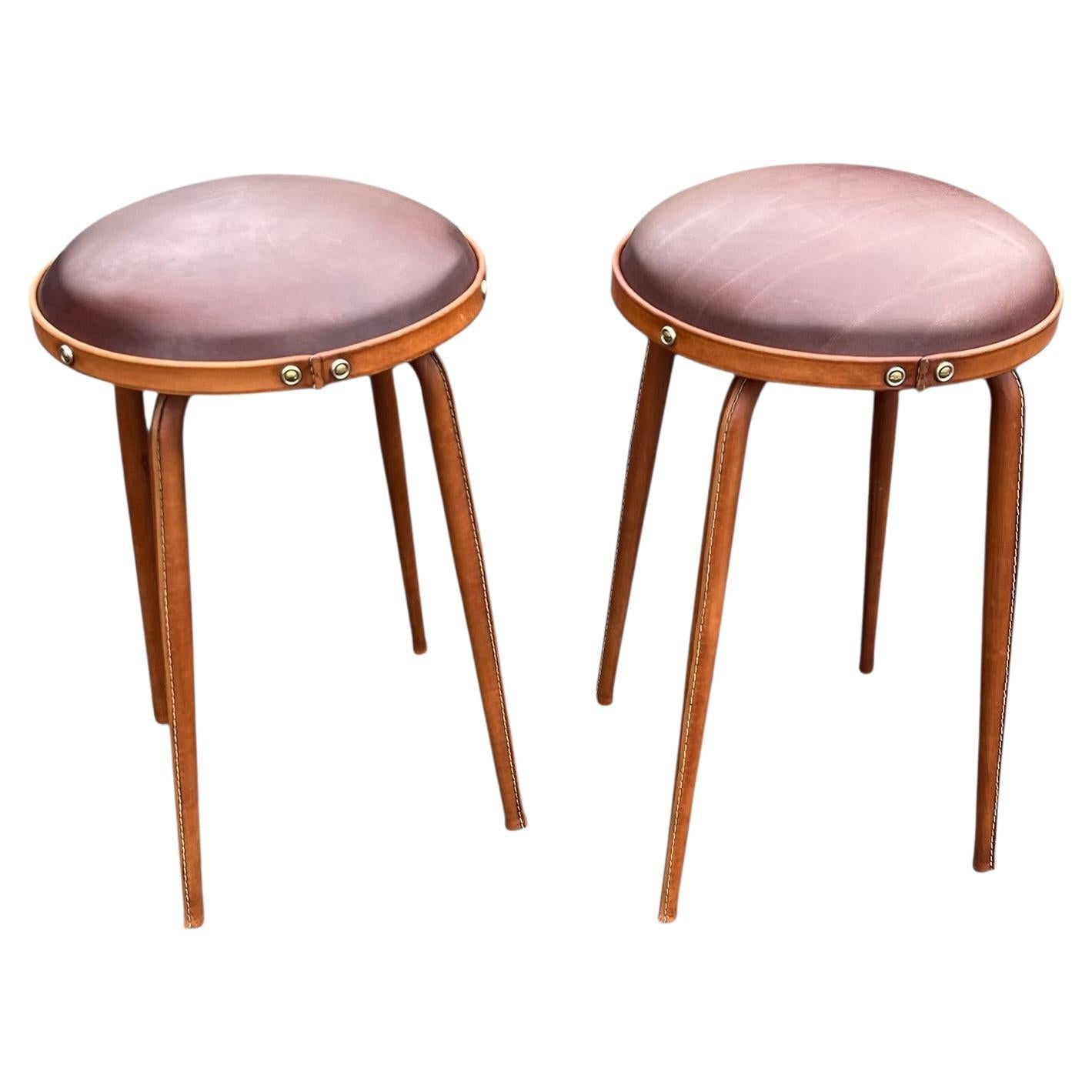 1950
s Stitched leather stools by Jacques Adnet For Sale