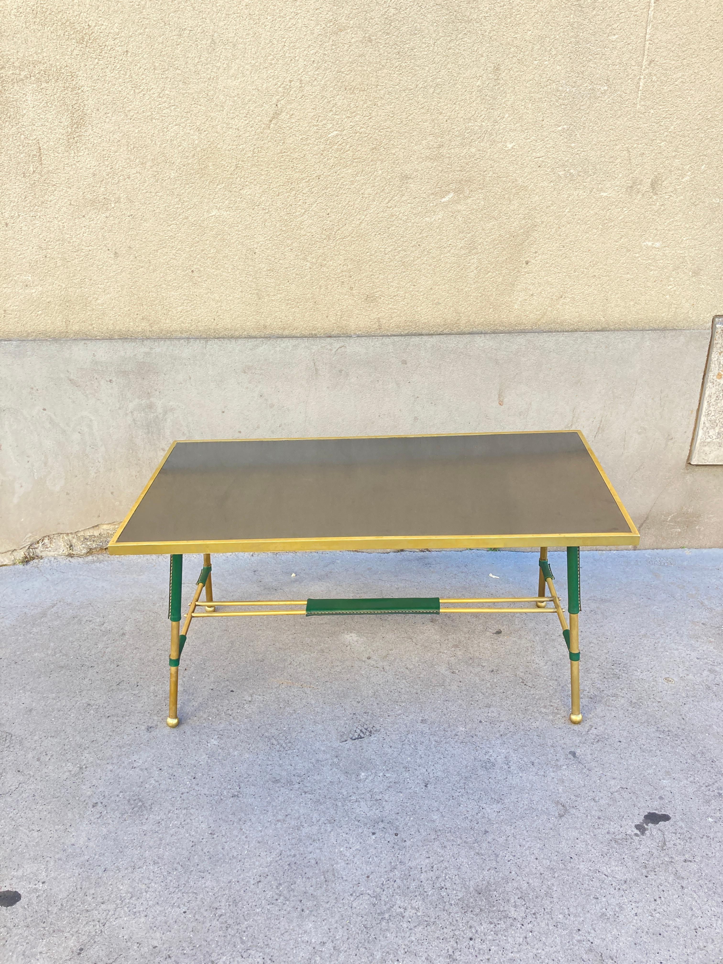 1950's Stitched leather, brass and formica cocktail table by Jacques Adnet
France
