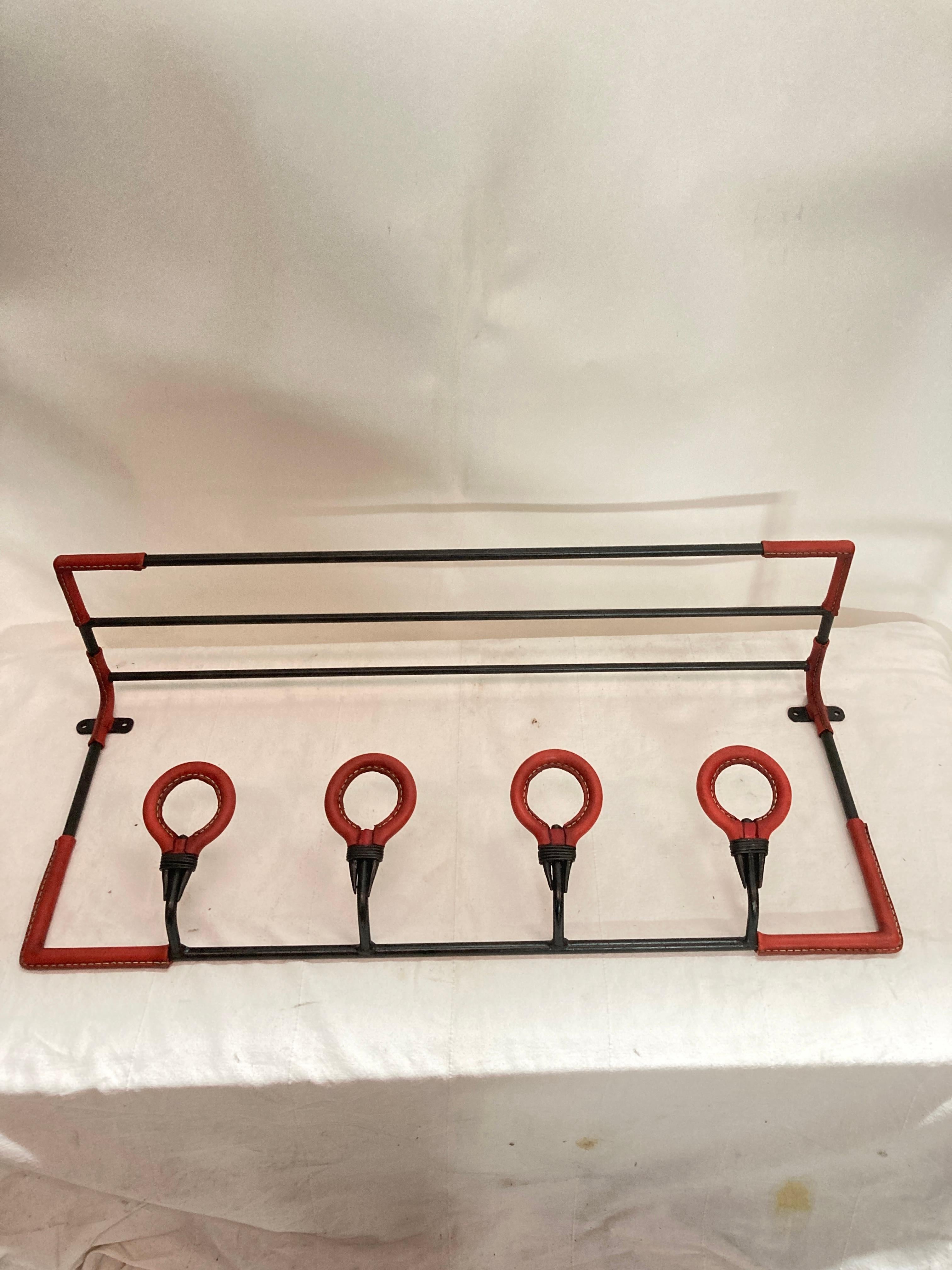 French 1950's Stitched leather wall coat rack by Jacques Adnet For Sale
