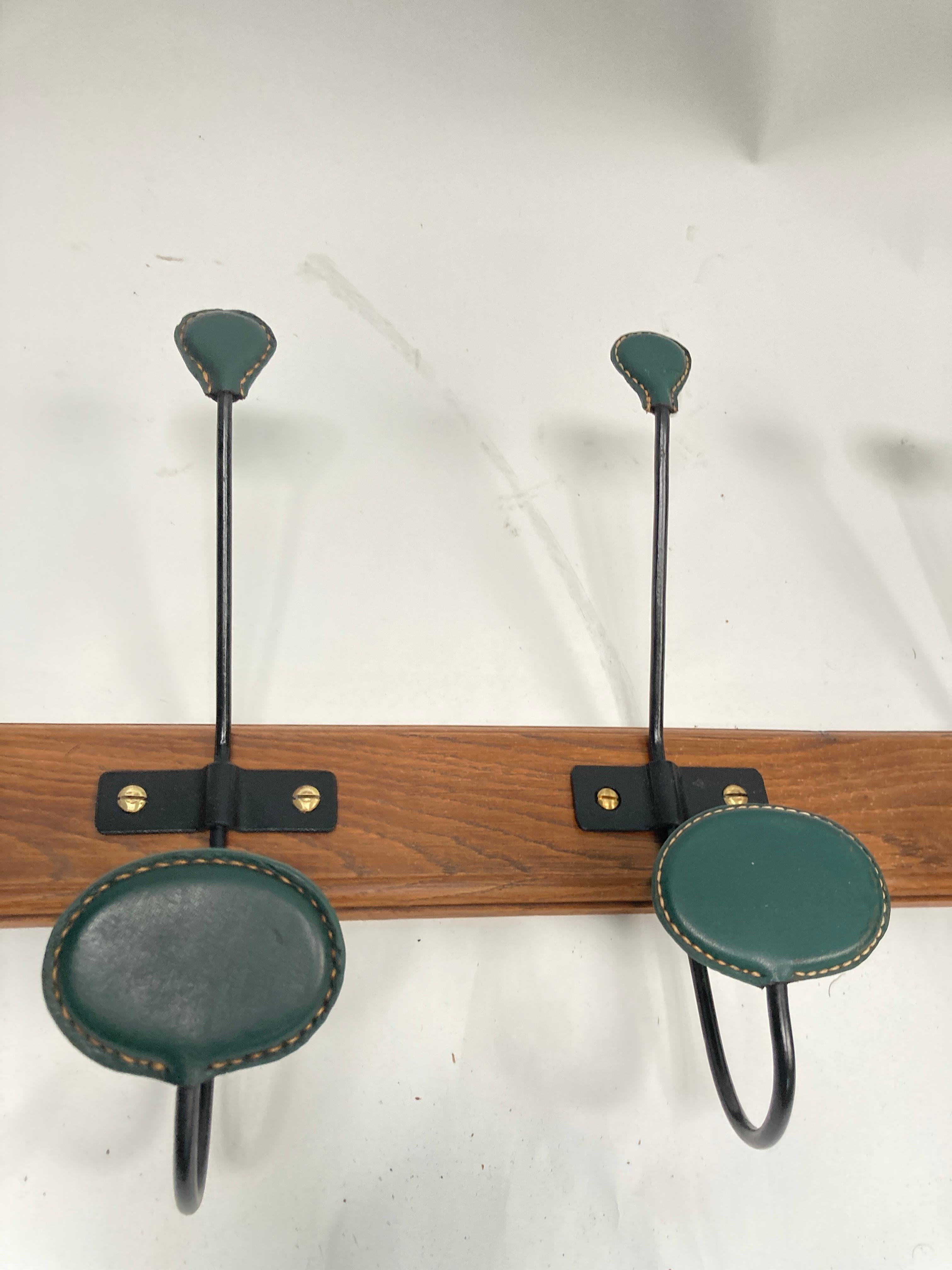 1950's Stitched leather wall coat rack by Jacques Adnet In Good Condition For Sale In Bois-Colombes, FR