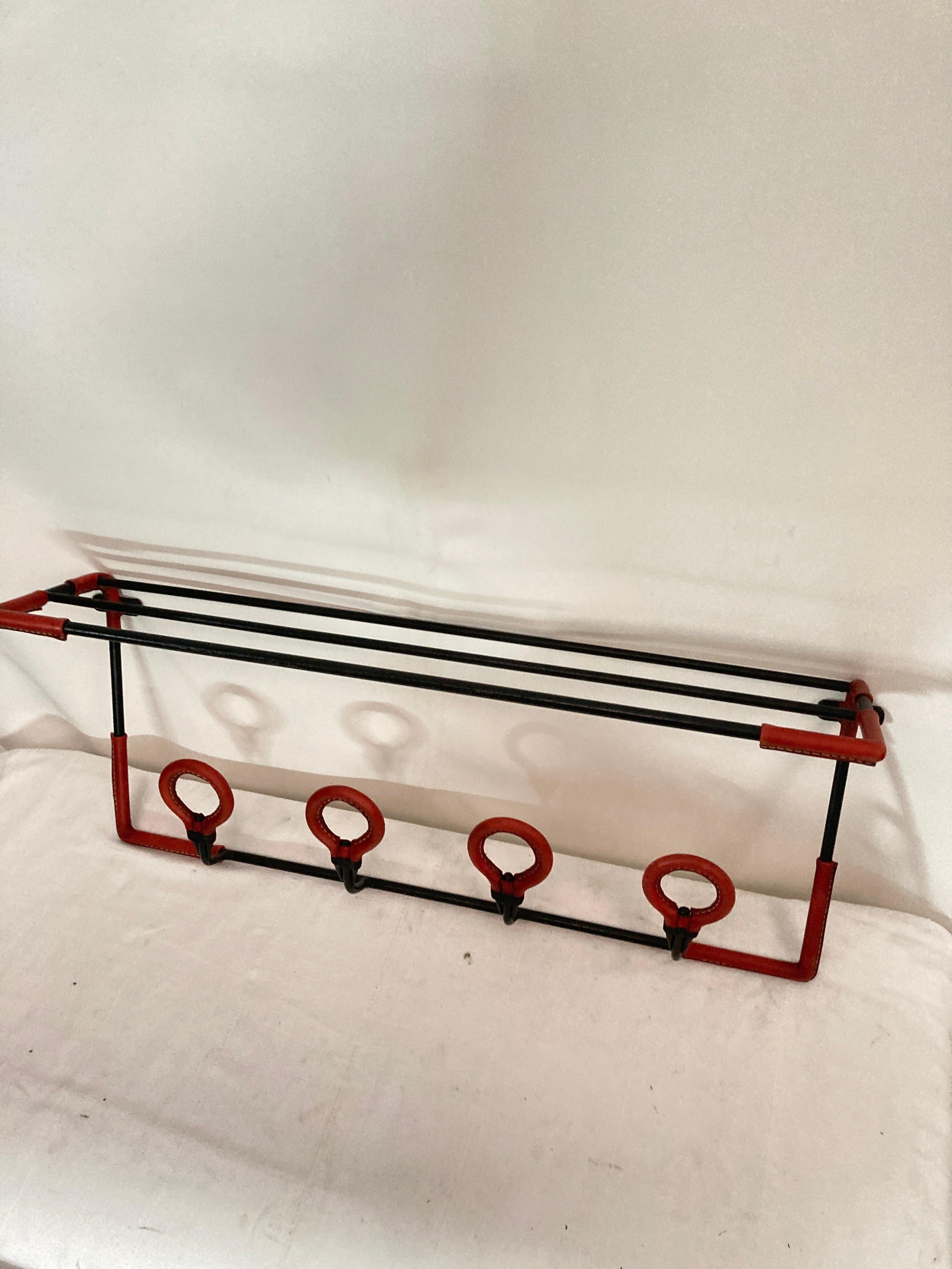 Metal 1950's Stitched leather wall coat rack by Jacques Adnet For Sale