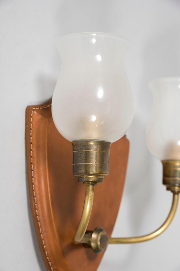 Brass 1950's Stitched Leather Wall Lights by Jacques Adnet For Sale