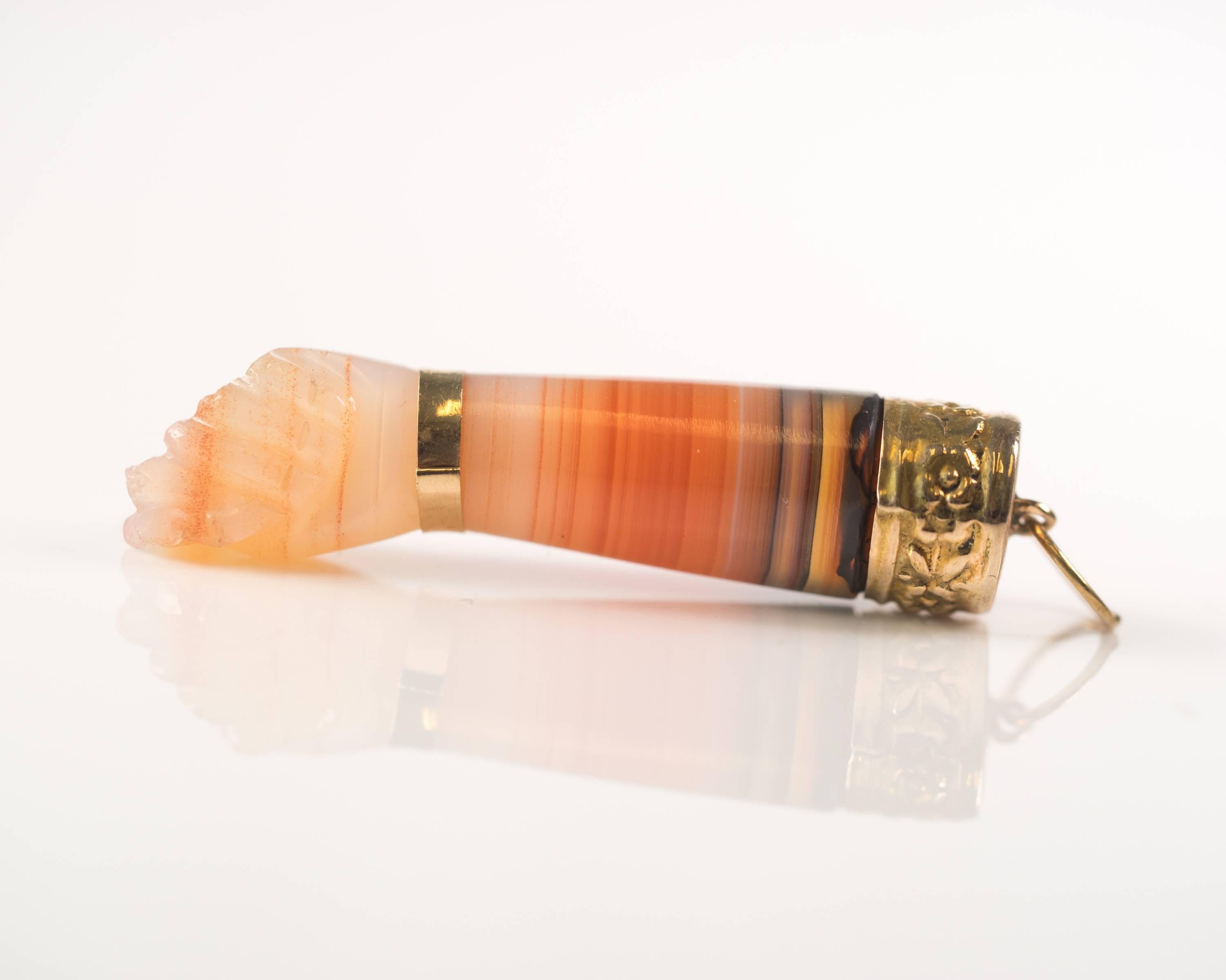 1950s Retro Mano Figa Pendant Charm - 18 Karat Yellow Gold, Translucent Earth Tone Striated Agate

Features translucent striated agate in earth tones graduating from deep charcoal amber to terracotta to creamy pink tones. A band of rich, high polish