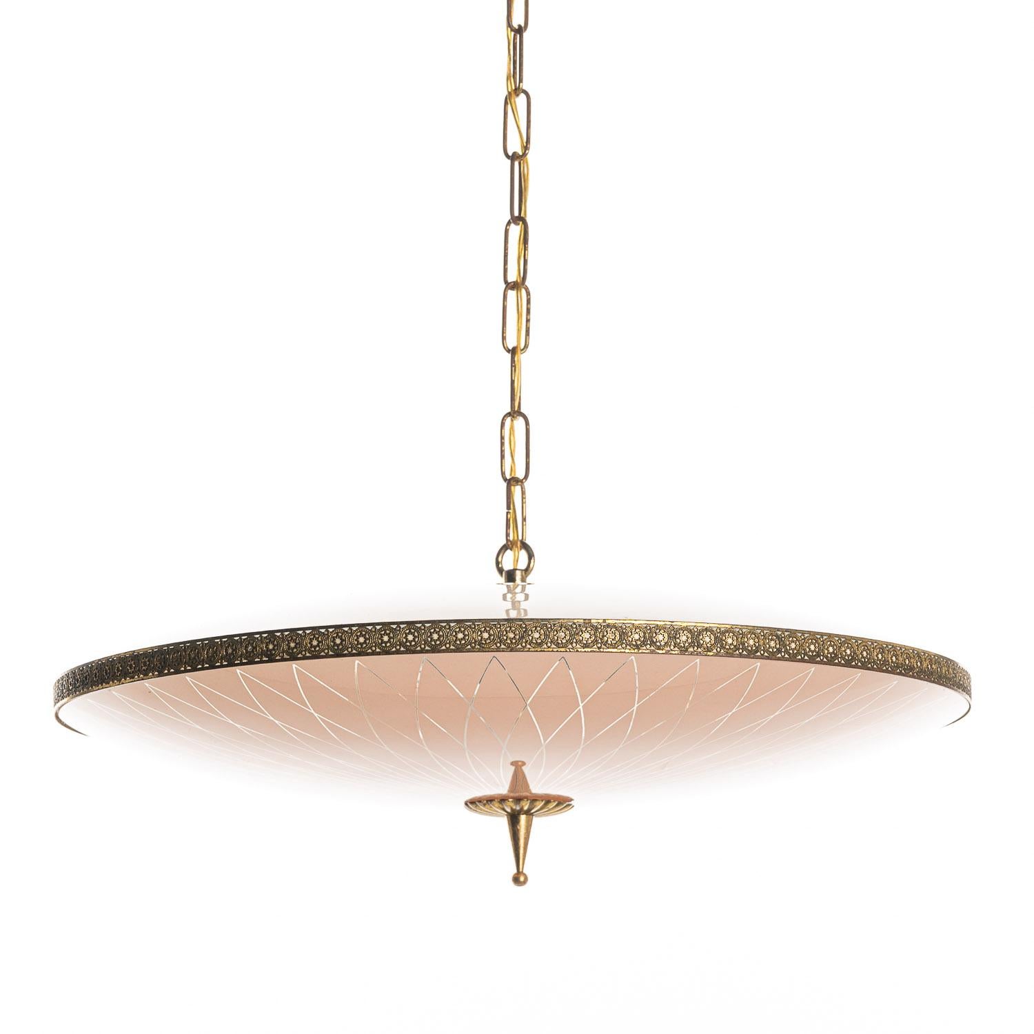This elegant piece consisting of a brass frame and 2 unique frosted and satin glass reflector / saucers. 
The lower round curved pink-colored glass reflector with clear stripe motifs mounts below a round pink-colored glass reflector. Finished off