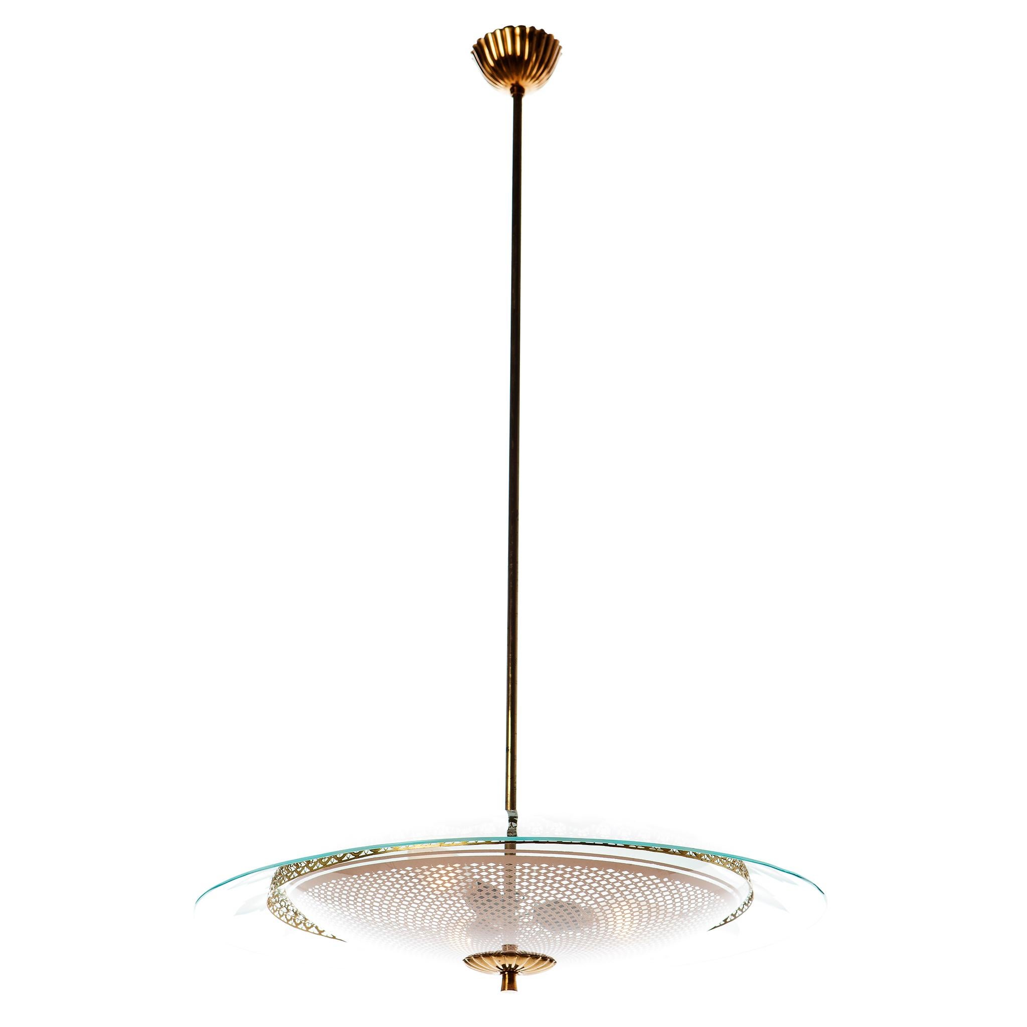 This stunning and super elegant light consisting of a brass frame and 2 unique glass reflector/saucers. 
The lower round curved glass reflector with pinkish grit motif mounts below a large round etched with flowers, clear glass reflector. To hide
