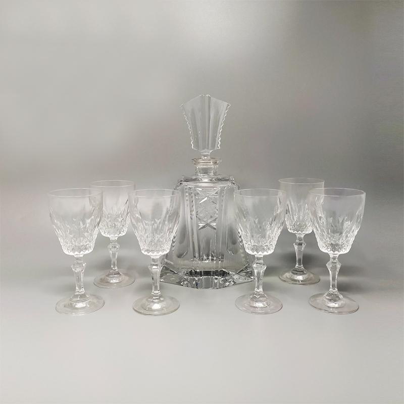 1950 Stunning crystal decanter with 6 crystal glasses. Made in Italy.
_ Decanter
_ 6 Glasses

Dimensions:
Decanter
5,51 x 3,93 x 9,84 inches
cm 14 x cm 10 x cm 25 H
Glasses
diameter 2,75 x 5,90 height inch
diametro 7 cm x 15 height.