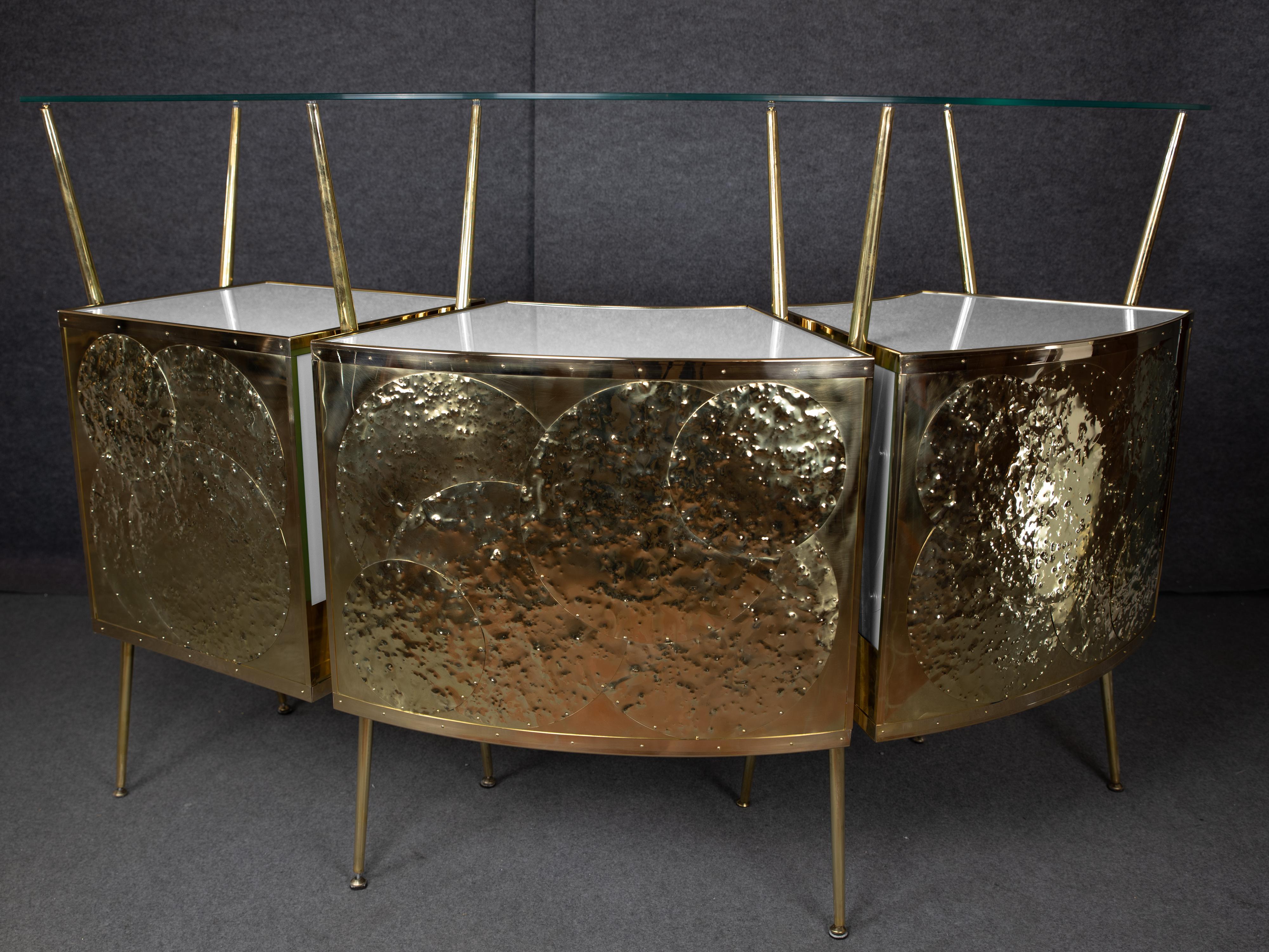 1950s-style Italian white Murano glass and brass cocktail bar

This stunning Italian cocktail bar embodies the essence of mid-century modern design, featuring elegant steam-curved wood, polished brass accents and exquisite white Murano glass.