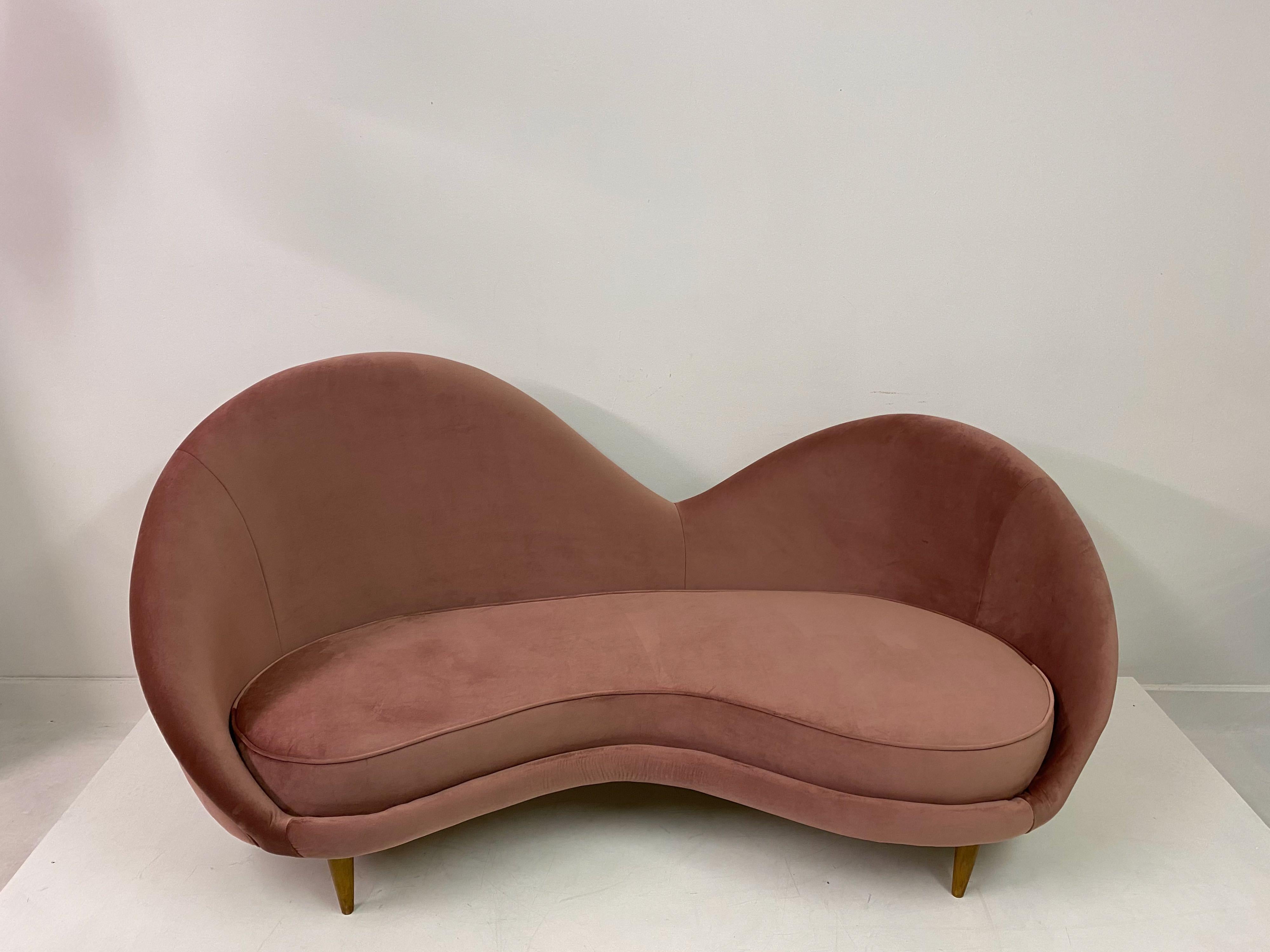 Unusual shaped sofa

1950s style

Soft tone pink velvet

Turned conical legs

Measures: Seat height 36cm

This one is in stock but others can be made to order in Italy

Can be upholstered in a fabric of your own choosing

Italy