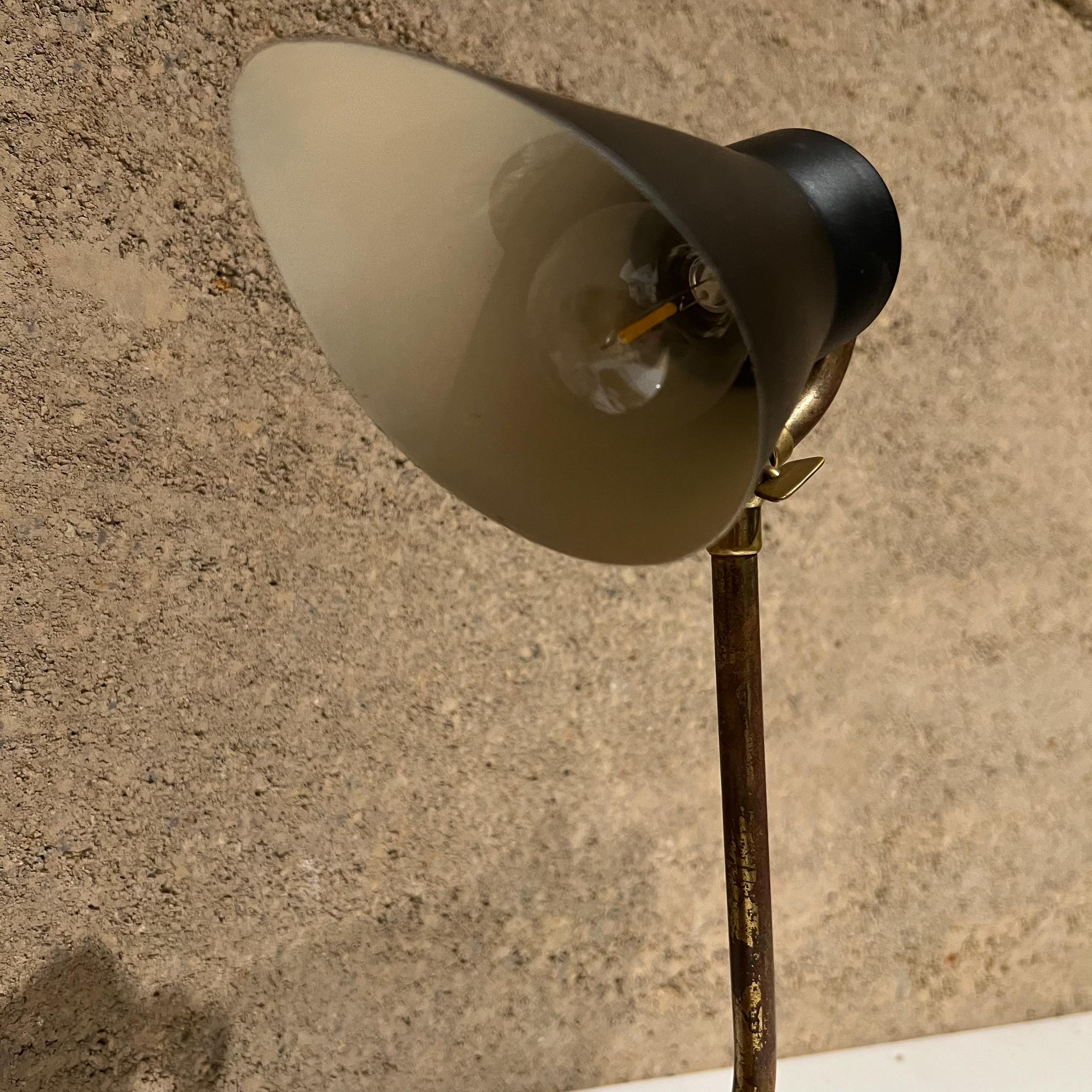 1950s table lamp modern sculptural task desk light in brass and black
Unmarked
Measures: 10.5 tall x 3.75 width x 9 depth
Task or desk lamp in brass with aluminum shade painted black
Preowned vintage condition, rewired. Tested and working
Refer