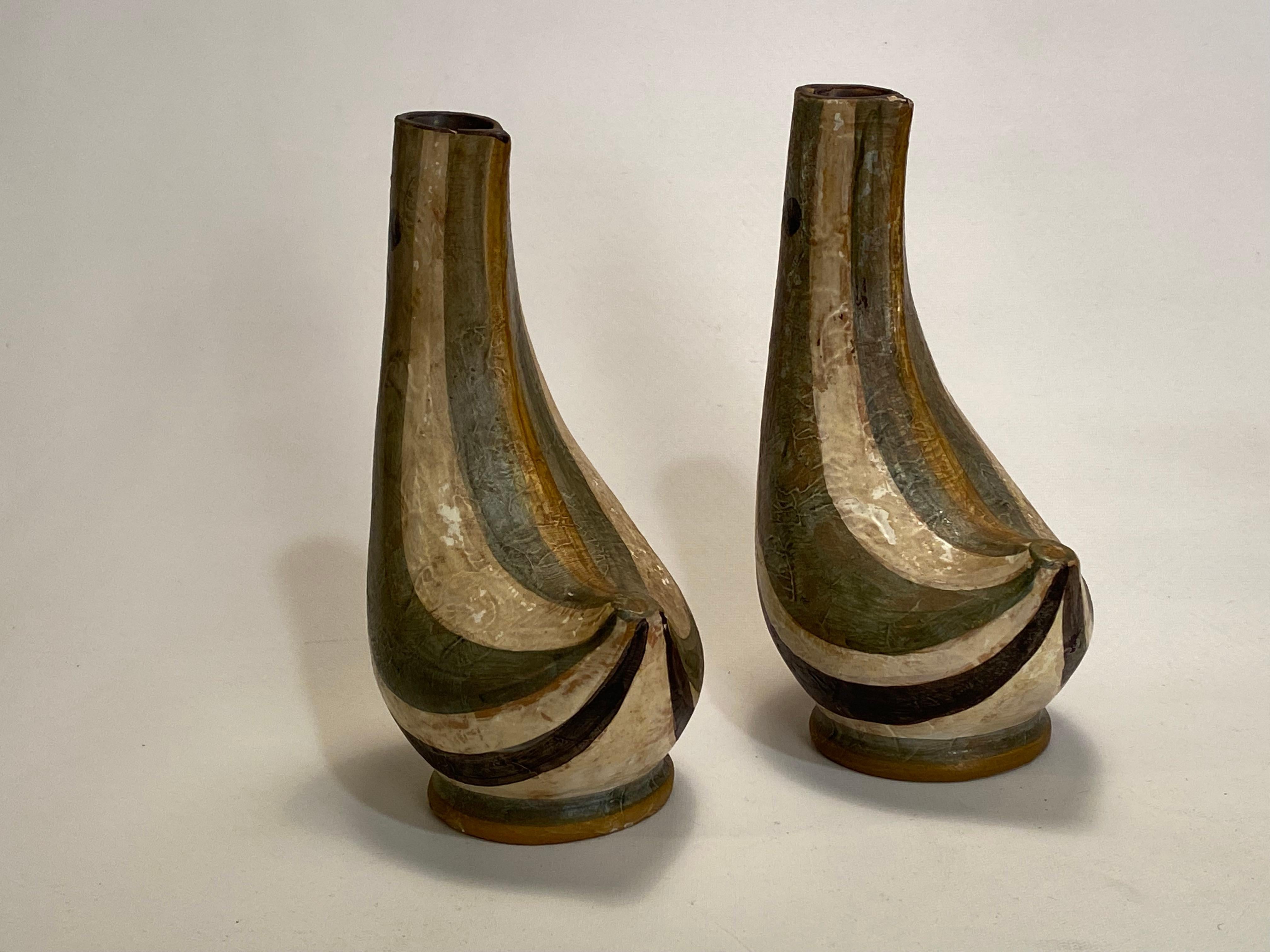 A fine pair of handmade Bitossi art pottery stylized bird vases. Great muted color palette of an olive green, black and white glazes. The finger print by the bird's eye is truly remarkable trace of identification history. Circa 1950-60. Good overall