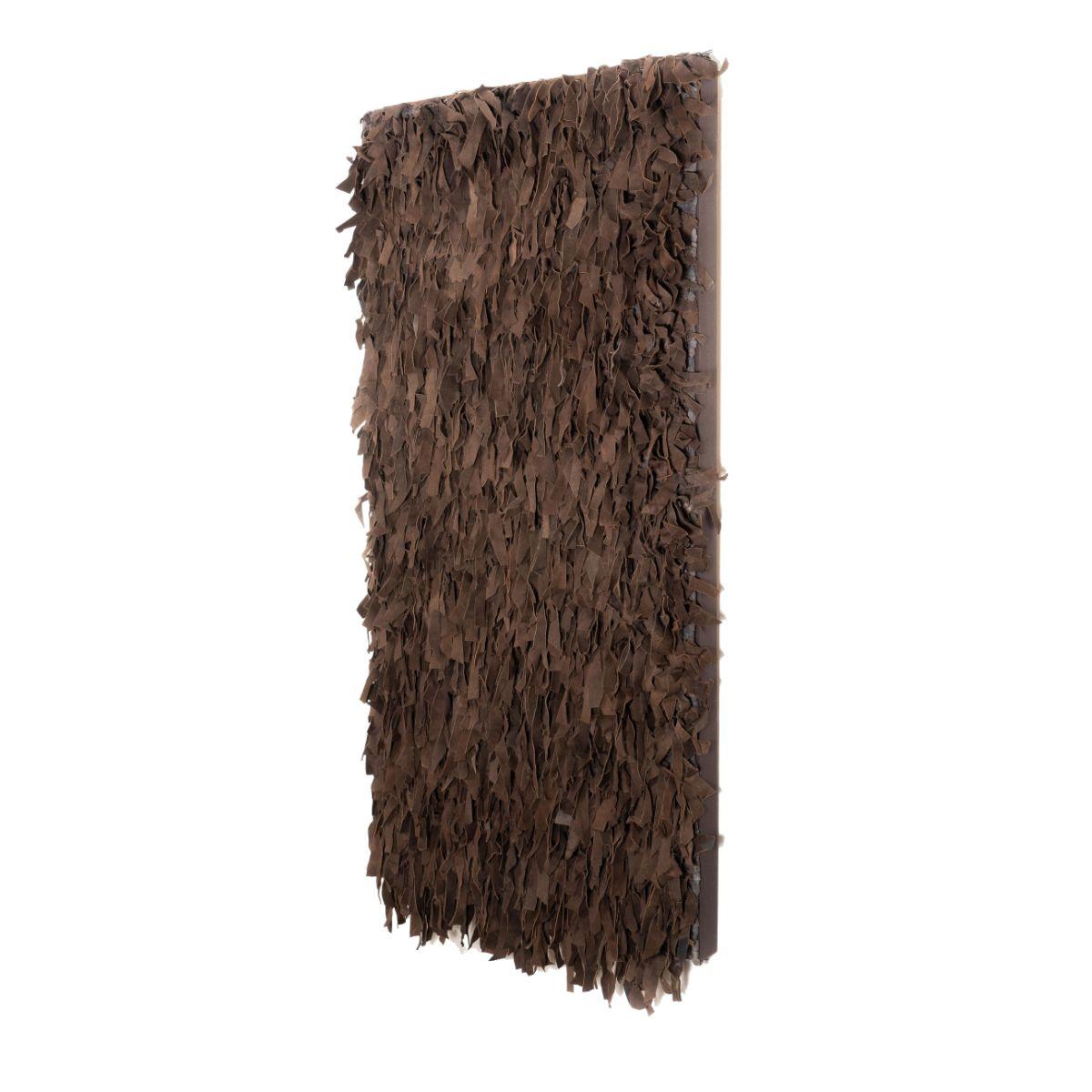 Coffee brown wall hanging of coffee brown sueded leather strips. The strips of suede are in randomized lengths and widths and have been woven into a cotton backing. The hanging has been stitched onto a canvas and mounted on a stretcher.
Mid 20th