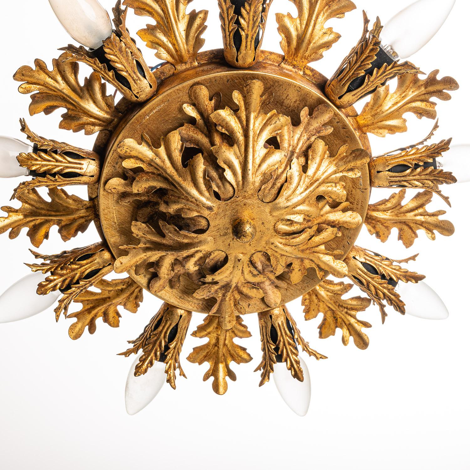 This stunning brass and metal feature is made by Banci in Italy in the 1970s. With It’s round shape, oak leaves and nine E14 lights shinning out make this feature the eye catcher of the room. 
This feature can be used as a flush mounts or it can be