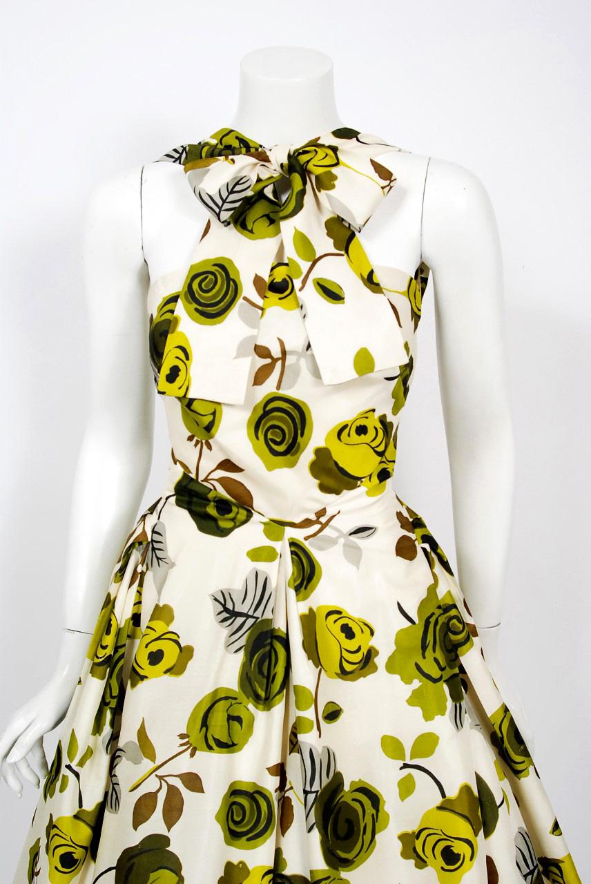 Gorgeous Suzy Perette designer chartreuse-green roses floral print silk dress dating back to the mid 1950's. Suzy Perette was not an actual person, but the name of a dress manufacturing company that made affordable versions of haute-couture Parisian