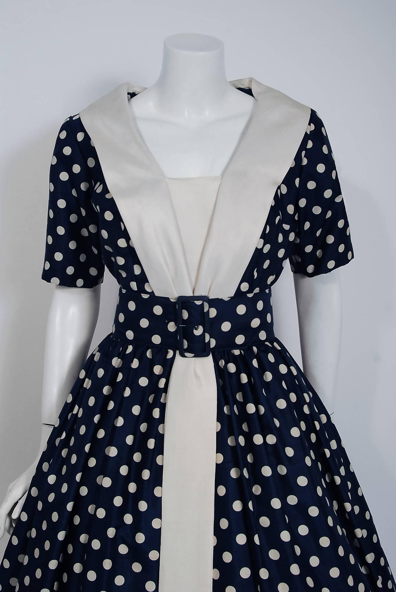 Gorgeous Suzy Perette designer navy and ivory polka-dot print silk party dress dating back to the mid 1950's. Suzy Perette was not an actual person, but the name of a dress manufacturing company that made affordable versions of haute-couture