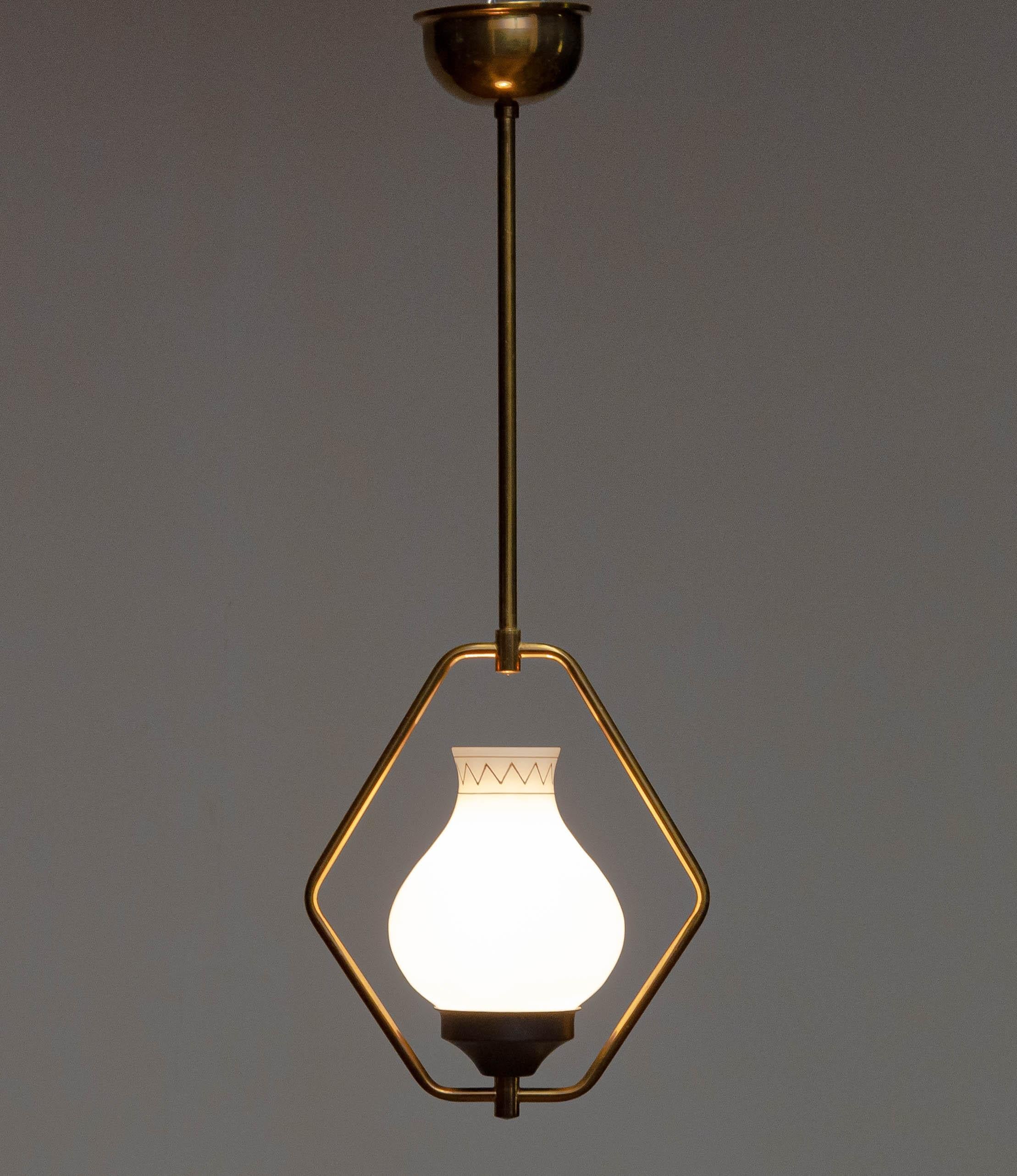 Beautiful pendant designed and produced in the 1950s combined with opal art glass vase / shade. The opal vase is hand painted with gold colour paint. There is one E27 / 28 screw fitting. Allover this pendant is in good condition and technically 100%.