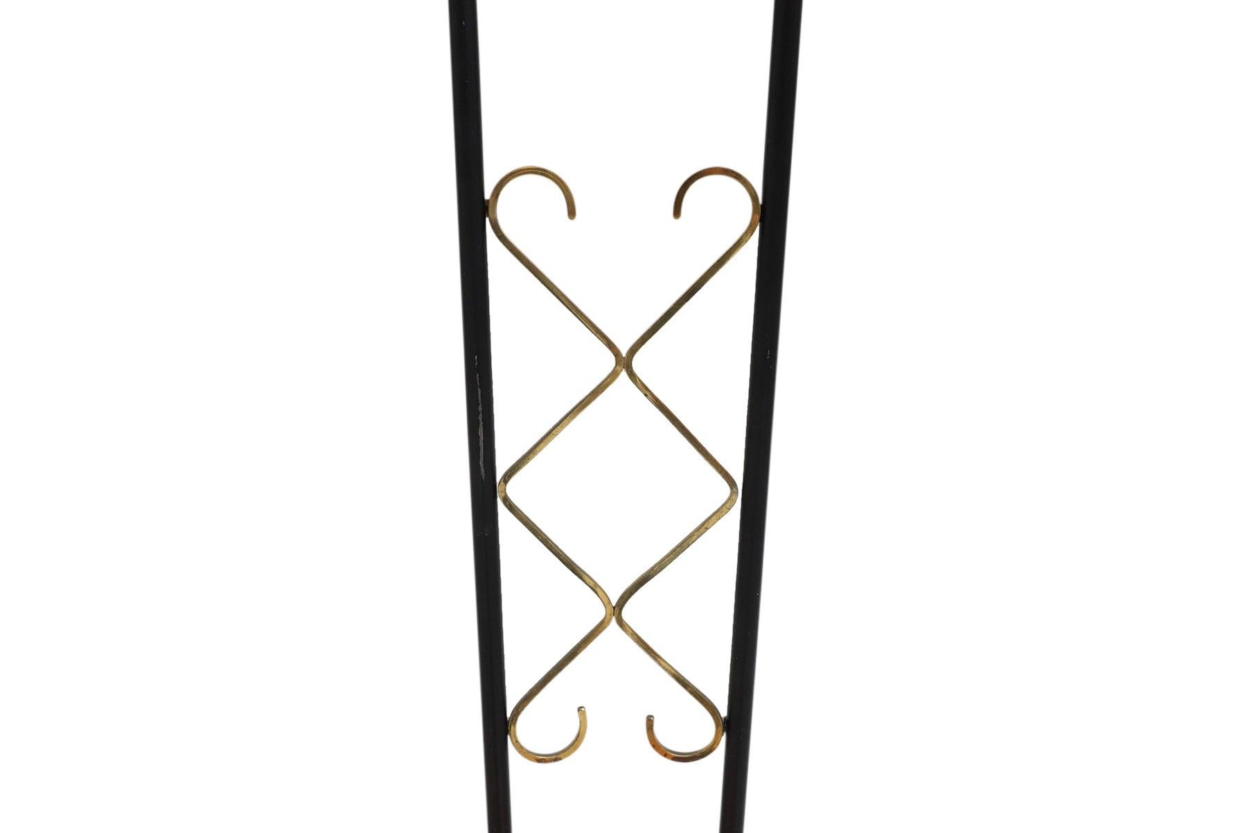 Origin: Sweden
Designer: Unknown
Manufacturer: Unknown
Era: 1950s
Materials: Teak, metal, glass
Measurements: 51? tall

Condition: In excellent original condition.