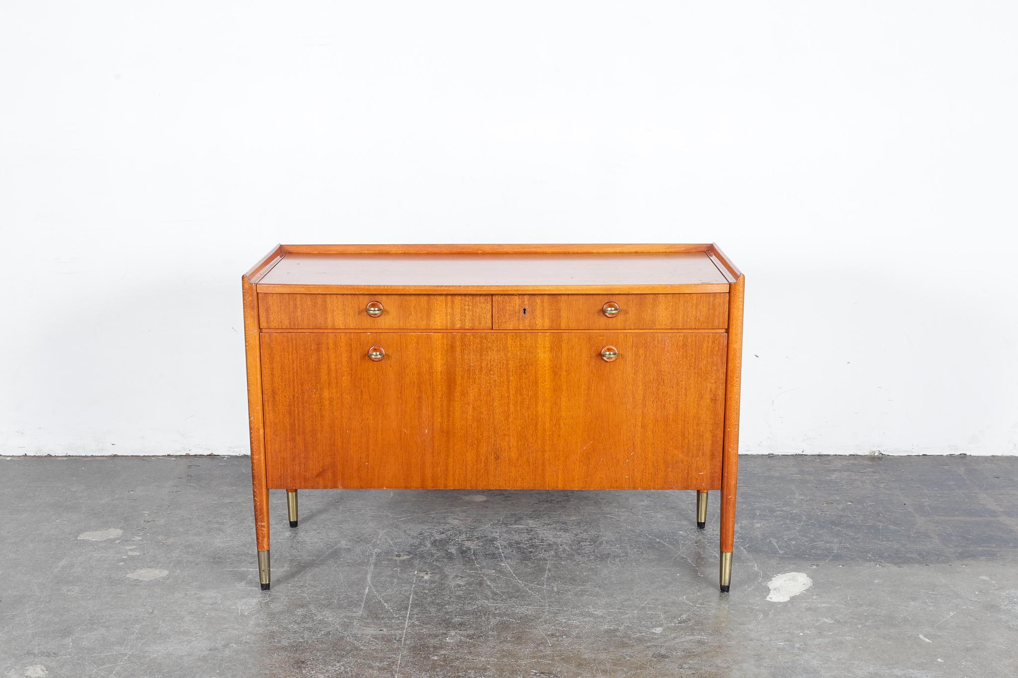 Swedish mahogany and beech 1950s cabinet with 2 upper drawers and a drop front door with multiple drawers behind it. Also has a sliding top revealing 2 secret hidden storage areas. Original finish untouched.