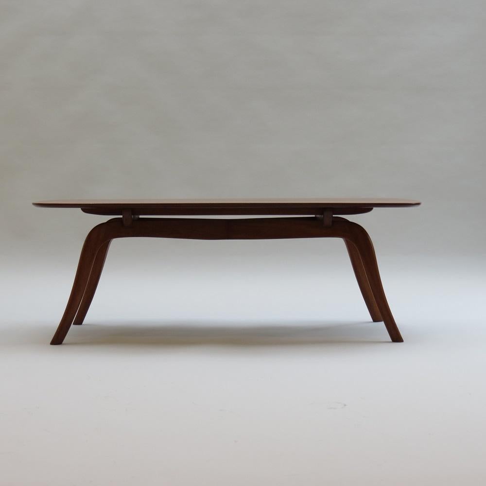 A wonderfully stylish and very good quality Swedish coffee Table dating from the 1950s. The top and legs are made from solid Brazilian Mahogany. Very nicely shaped legs give the impression that the top of the table is floating.  In good over all