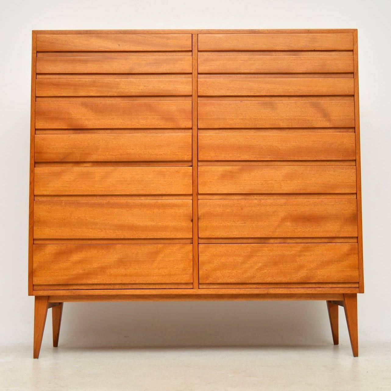 A very large, impressive and stylish chest of drawers, this was made in Sweden and it dates from the 1950s-1960s. It is made from satin wood, we have had it stripped and re-polished to a very high standard, the condition is superb throughout. It’s