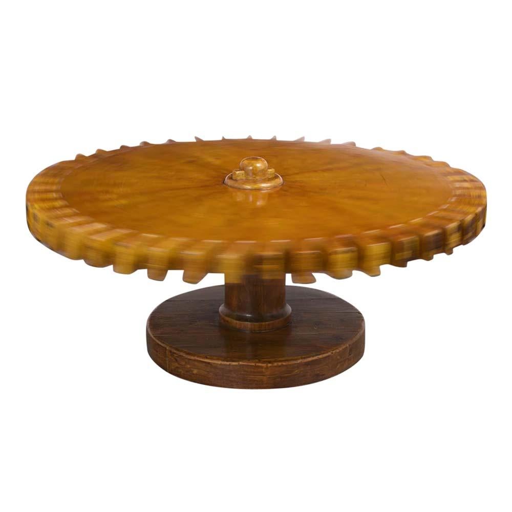 This Mid-Century Modern style swivel coffee table has been fully restored. This table has a unique gear design top made from maple wood that swivels and rotates all the way around. The pedestal round carved base is made from solid pine wood and is