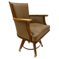 1950s swivel office chair in cherry wood and leather attributed to Jacques Adnet