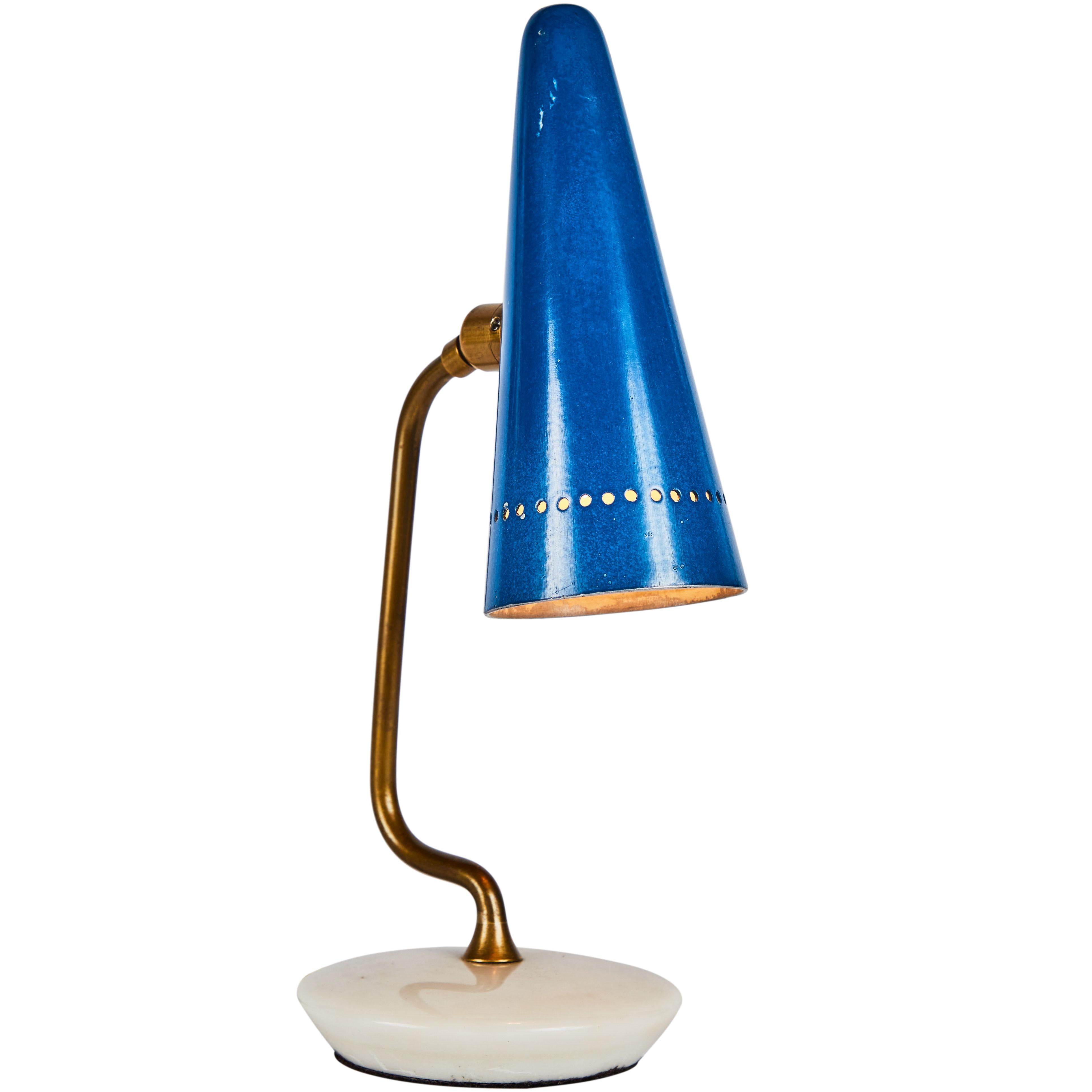 1950s table lamp attributed to Gino Sarfatti for Arteluce. This extremely refined and sculptural design retains its wonderfully knackered original blue painted aluminum shade brass hardware and marble base. The cone shade rotates on a brass swivel