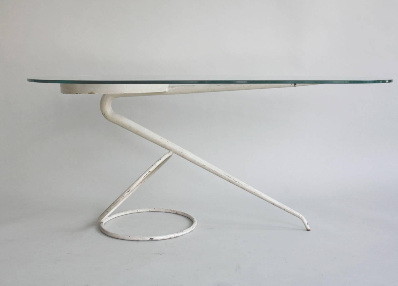 Unusual original 1950s sculptural white or cream shaped metal side or wall table with an ovoid glass top.