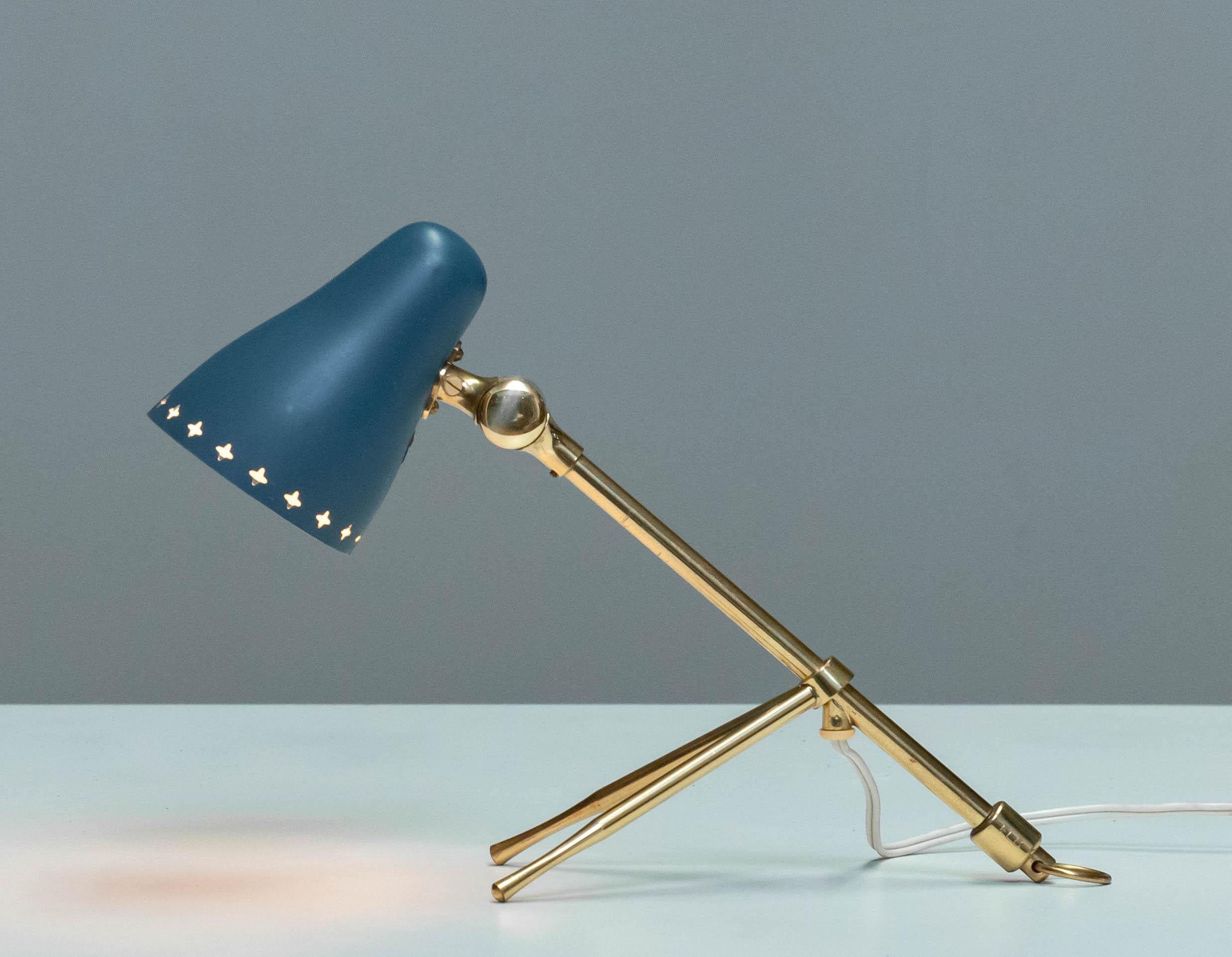 Beautiful designed table / wall lamp by Jean Boris Lacroix for Falkenbers Belysning in Sweden in the 1950s. The lamp is made of brass with a aluminum patrol color perforated shade and is in allover good condition. Technically 100% and consists one