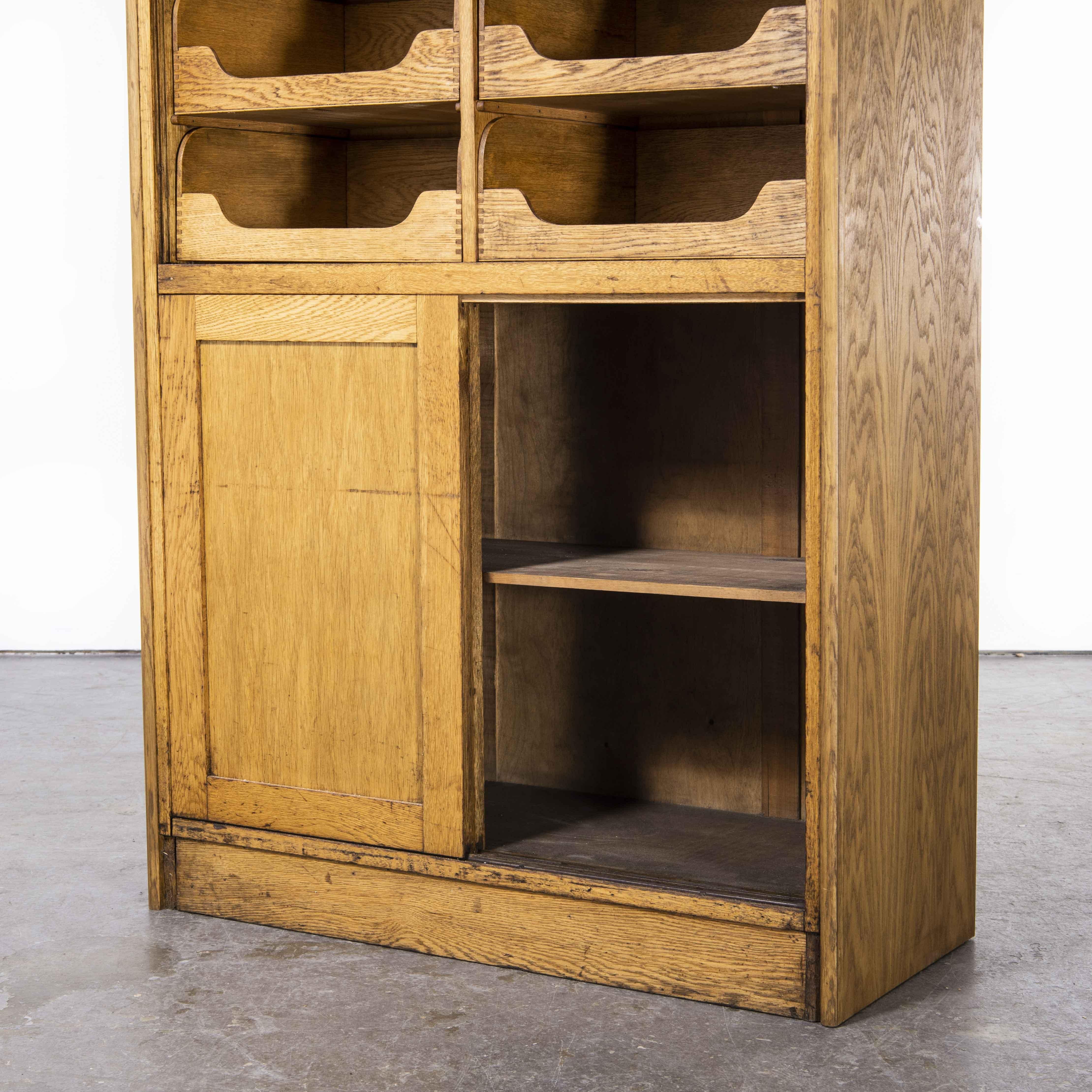 Oak 1950's Tall English Haberdashery Shelved Cabinet, Sixteen Drawers 'Model 1244.1' For Sale