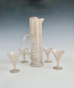 1950s tall martini pitcher with four glasses with gold and white flek decoration