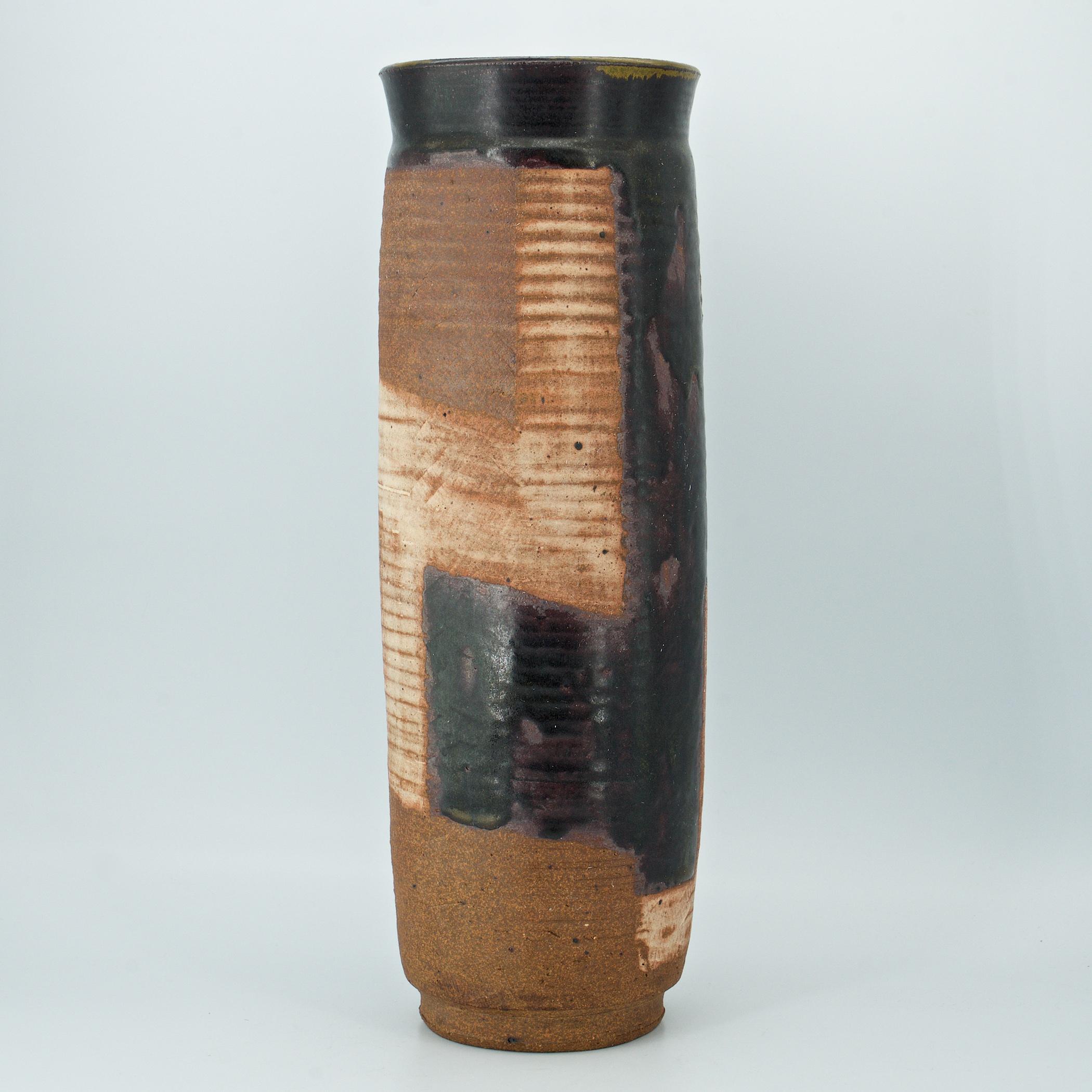 Wonderful hand-thrown abstract glazed ceramic flower vase. Over 15 inches tall.
