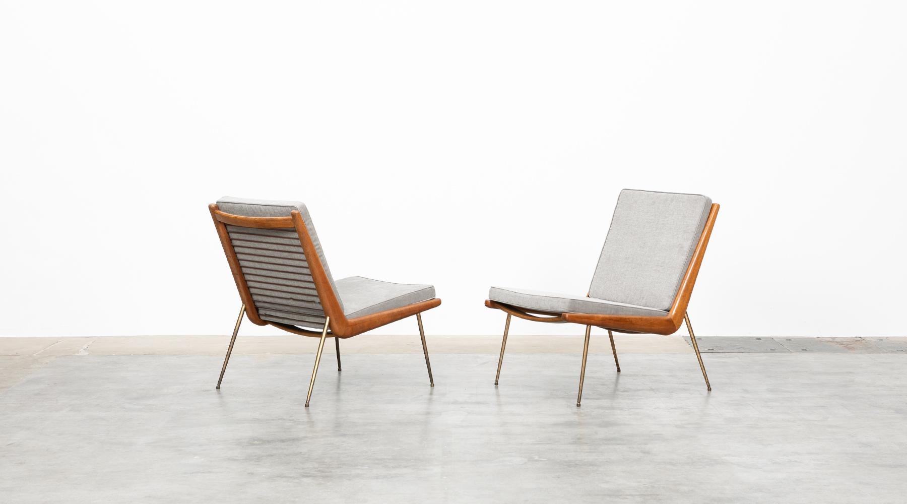 Lounge Chairs, teak and brass, upholstery, Peter Hvidt, Denmark, 1955.

Peter Hvidt and Orla Mølgaard-Nielsen designed this legendary pair of Lounge Chairs. The sculptural design made of teak and the finely crafted braces in the back has been
