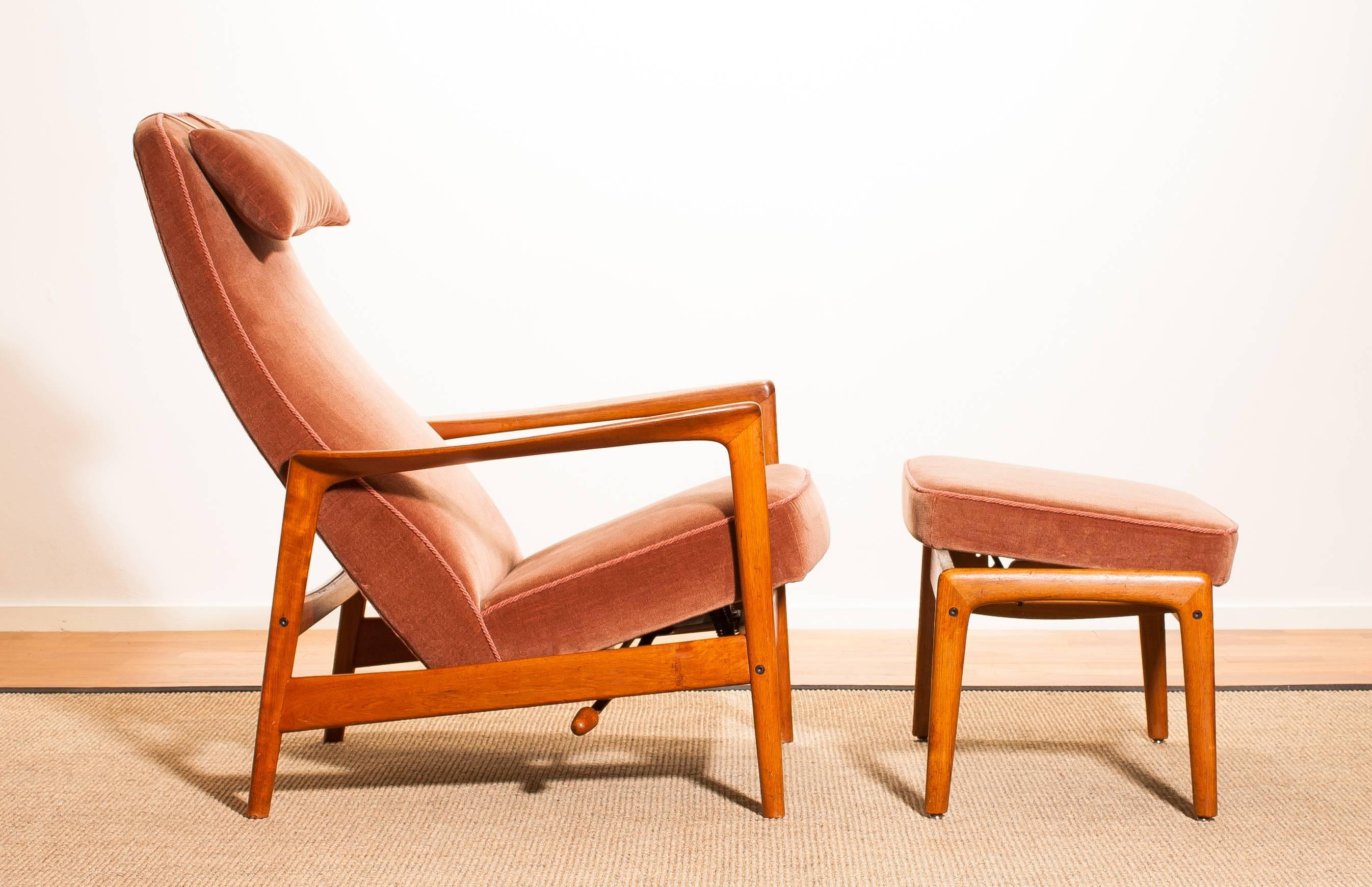Midcentury teak lounge chair and ottoman designed by Folke Ohlsson for DUX. 
The solid teak frame with the original velours fabric is in mint condition. (Chair and ottoman)
This very comfortable chair with a rocking motion (eight adjustable