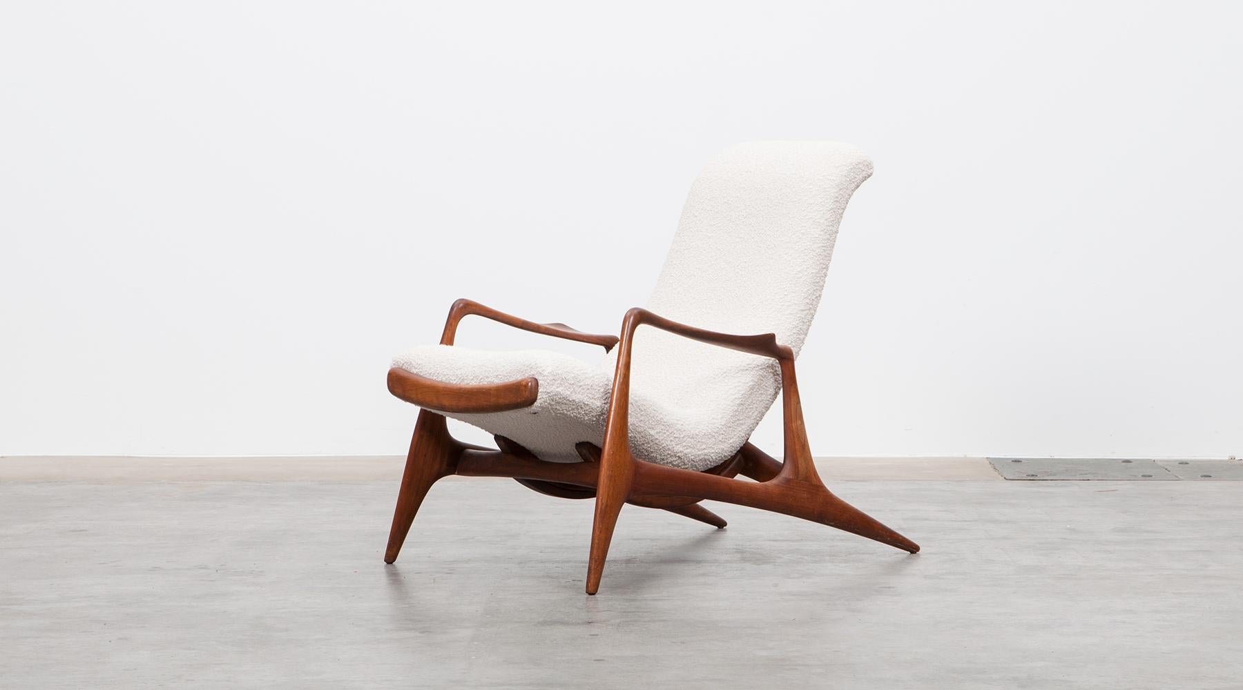 Lounge chair in teak, new upholstery, USA, 1956.

The design of the multi-position reclining chair was as fluid as its reclining movement. The sweeping organic lines and shapes are inspired by leaves and arboreal forms. The chair has a pull-out
