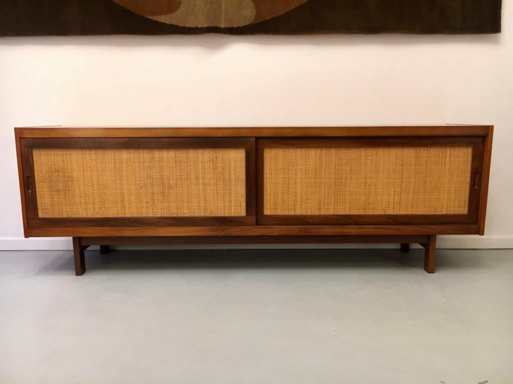 1950s teak and cane sliding doors sideboard in the manner of Hans Wegner
Completely restored by a cabinetmaker.
4 drawers inside.