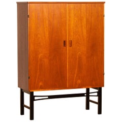 1950s, Teak High Board Buffet Cabinet on Black Stand, Sweden 1950s, Teak High Board Buffet Cabinet on Black Stand, Sweden