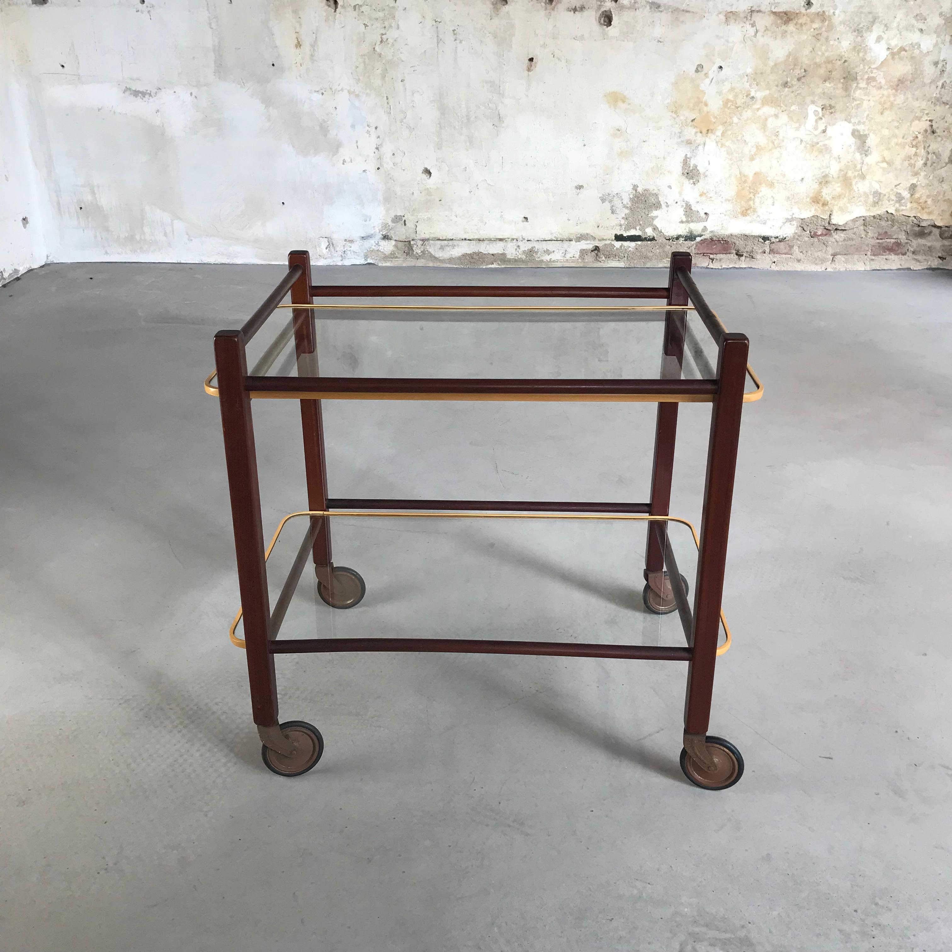 Beautiful serving trolley in totally original state. Designed by Cees Braakman and produced by UMS Pastoe in 1950s. The trolley has a solid teak frame and glass plates with original rubber protection, one of the first series. The beautiful teak