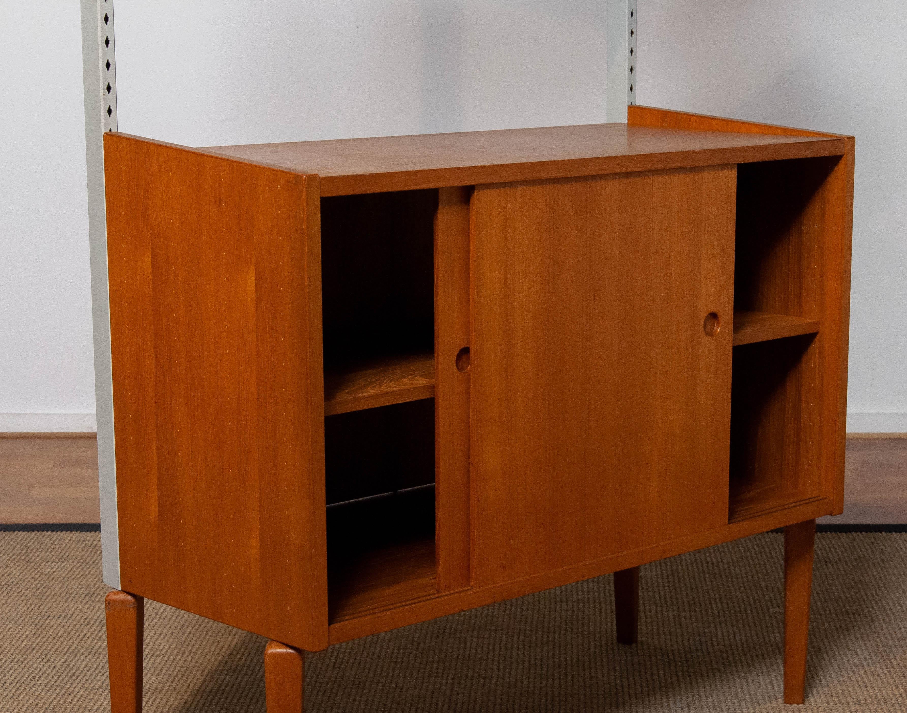 1950's Teak Shelf System / Bookcase in Teak with Steel Bars by Harald Lundqvist For Sale 2