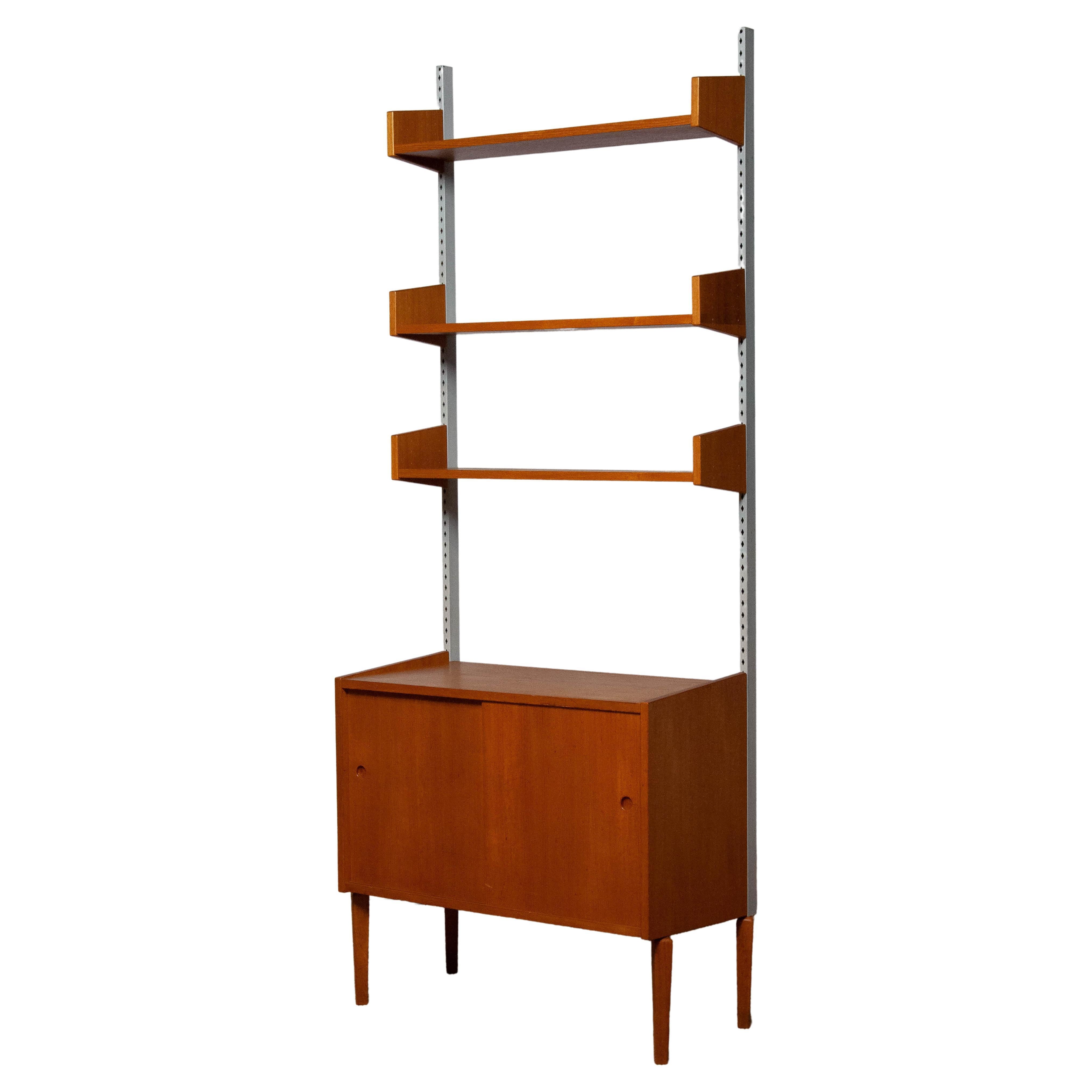 1950's Teak Shelf System / Bookcase in Teak with Steel Bars by Harald Lundqvist For Sale