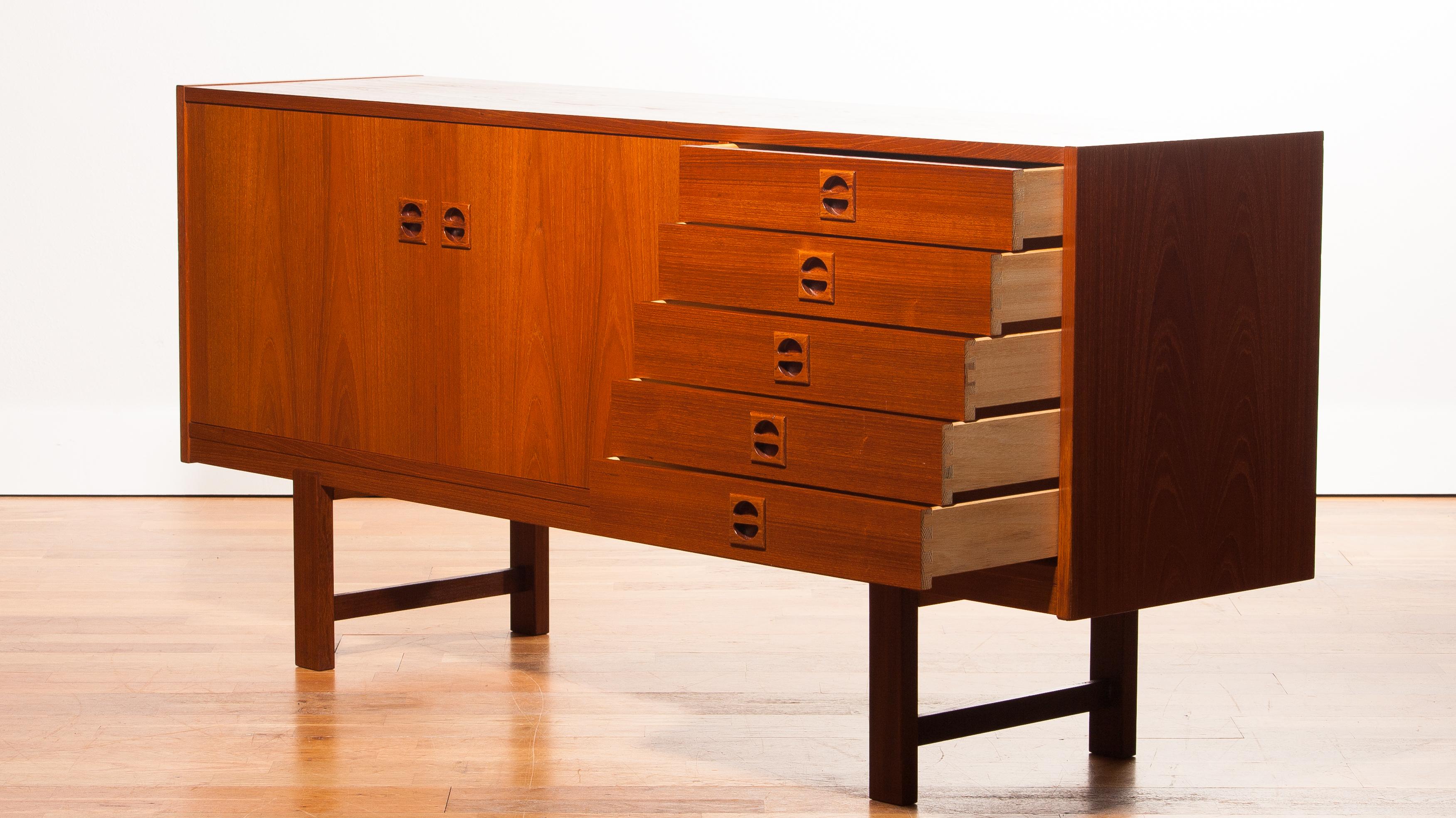 Beautiful sideboard designed by Erik Wørts, Denmark.
The cabinet is made of a very nice teak veneer and has five drawers and two doors.
It is in a wonderful condition.
Period 1950s
Dimensions: H76 cm, W 164 cm, D 42 cm.