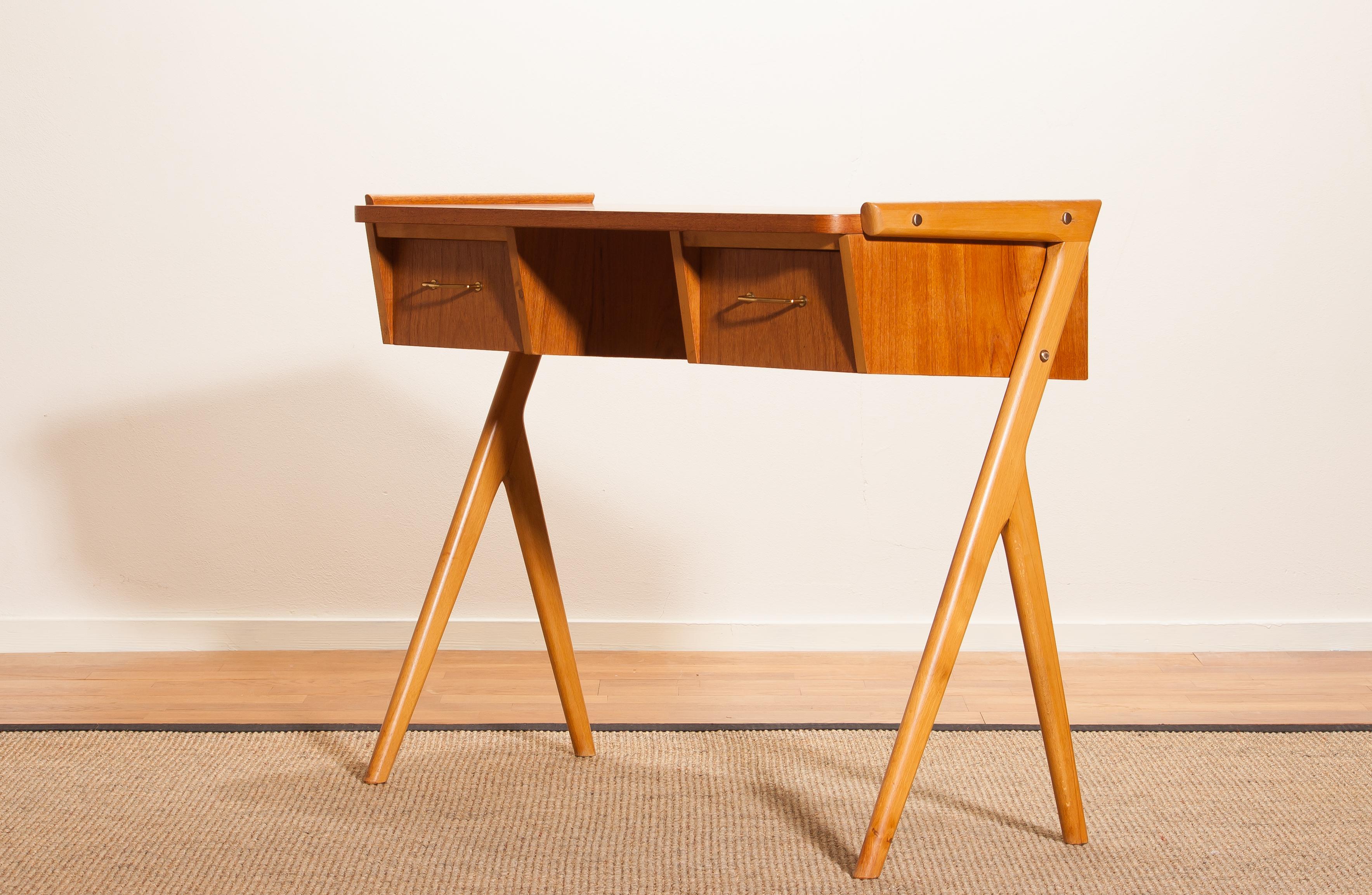 Very beautiful vanity or ladies desk from Sweden
The table is made of teak and has two drawers with brass details.
It is in a very nice condition.
Period, 1950s.
Dimensions: H 70 cm, W 84 cm, D 40 cm.