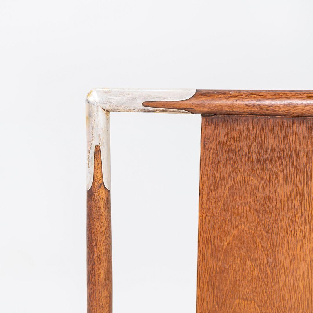 This is a King Size Headboard, designed by T.H Robsjohn Gibbings for Widdicomb. This particular example dates back to the 1950s and was produced in Michigan, USA. The design is comprised of walnut and features brass hardware. 
 
 The headboard