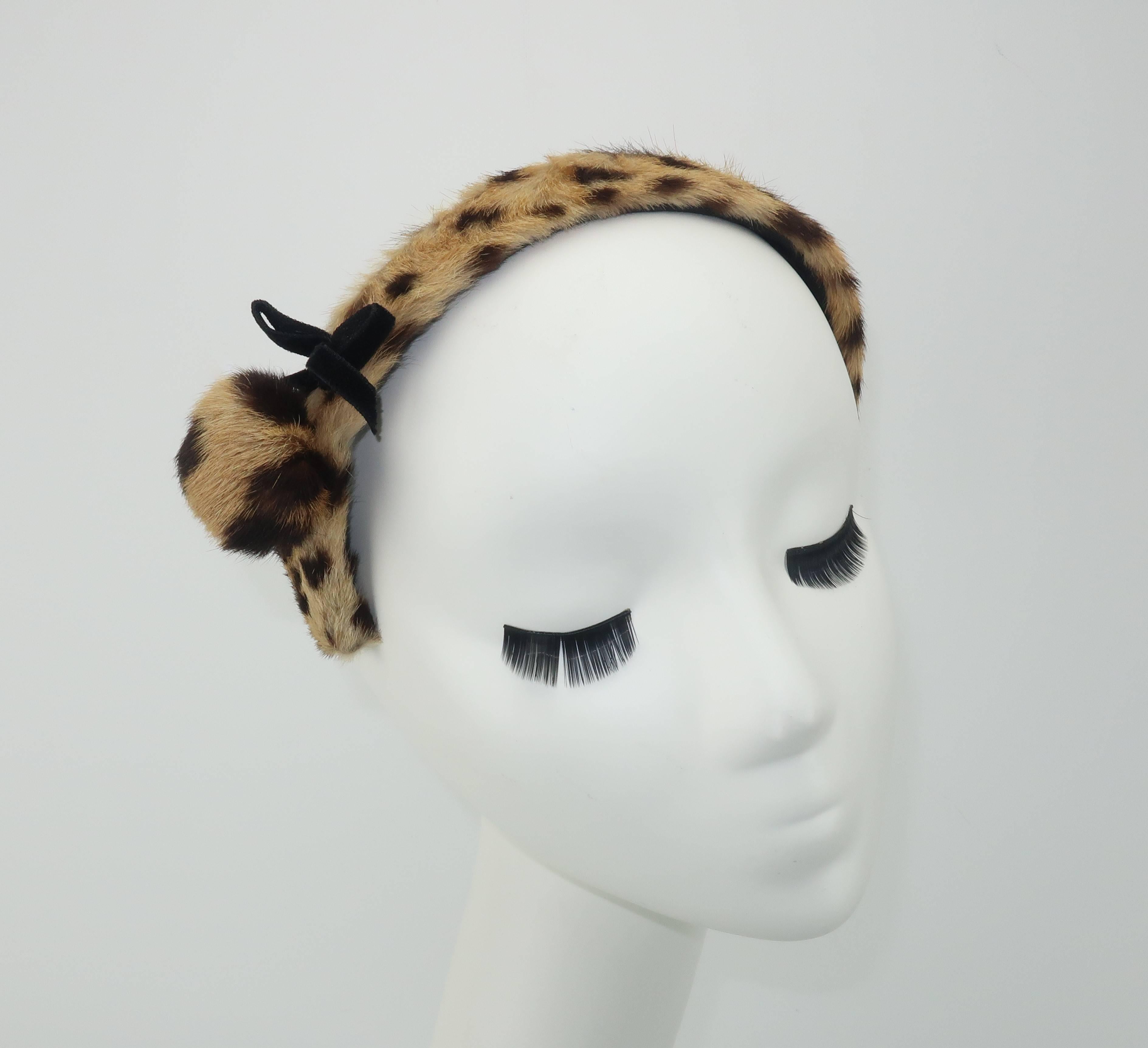 Cute, coquettish and chic!  This precious 1950’s headband by Therese Ahrens has elements of a pin-up girl look with a fashionable sensibility perfect for adding a vintage accessory to your look.  The headband measures 12.25
