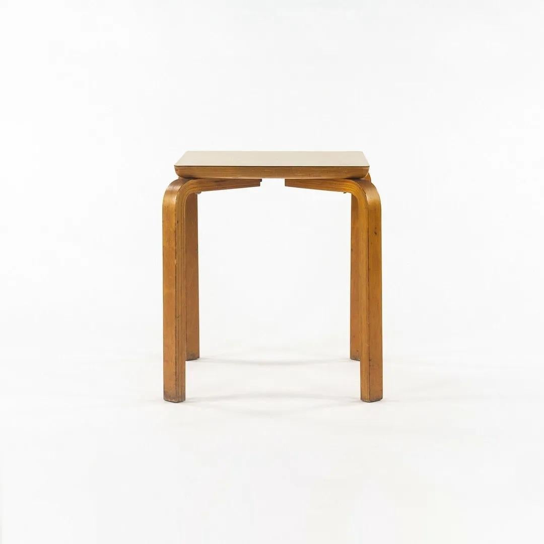 Listed for sale is a 1950s Thonet bentwood side table with legs designed in a similar manner to that of Alvar Aalto. These tables are iconic works of 1950s furniture design, as Thonet produced countless works of influential furniture during that