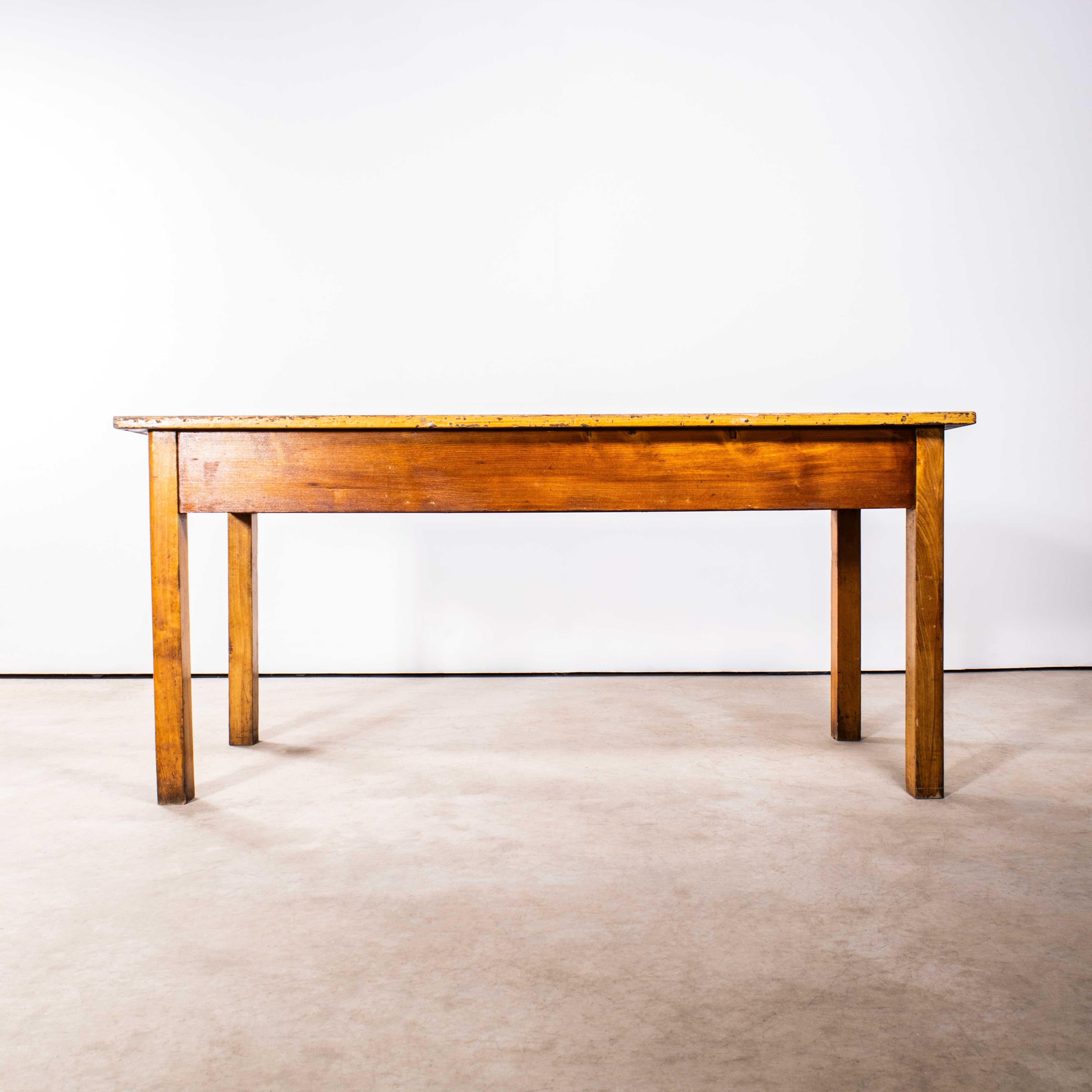 1950’s Three Drawer Blonde Faux Grain Simple French Workshop Desk. 

Good honest original desk or console table. Sourced in France, the desk is unusual, the main frame is made from beech, the drawers are pitch pine and the top retains the original